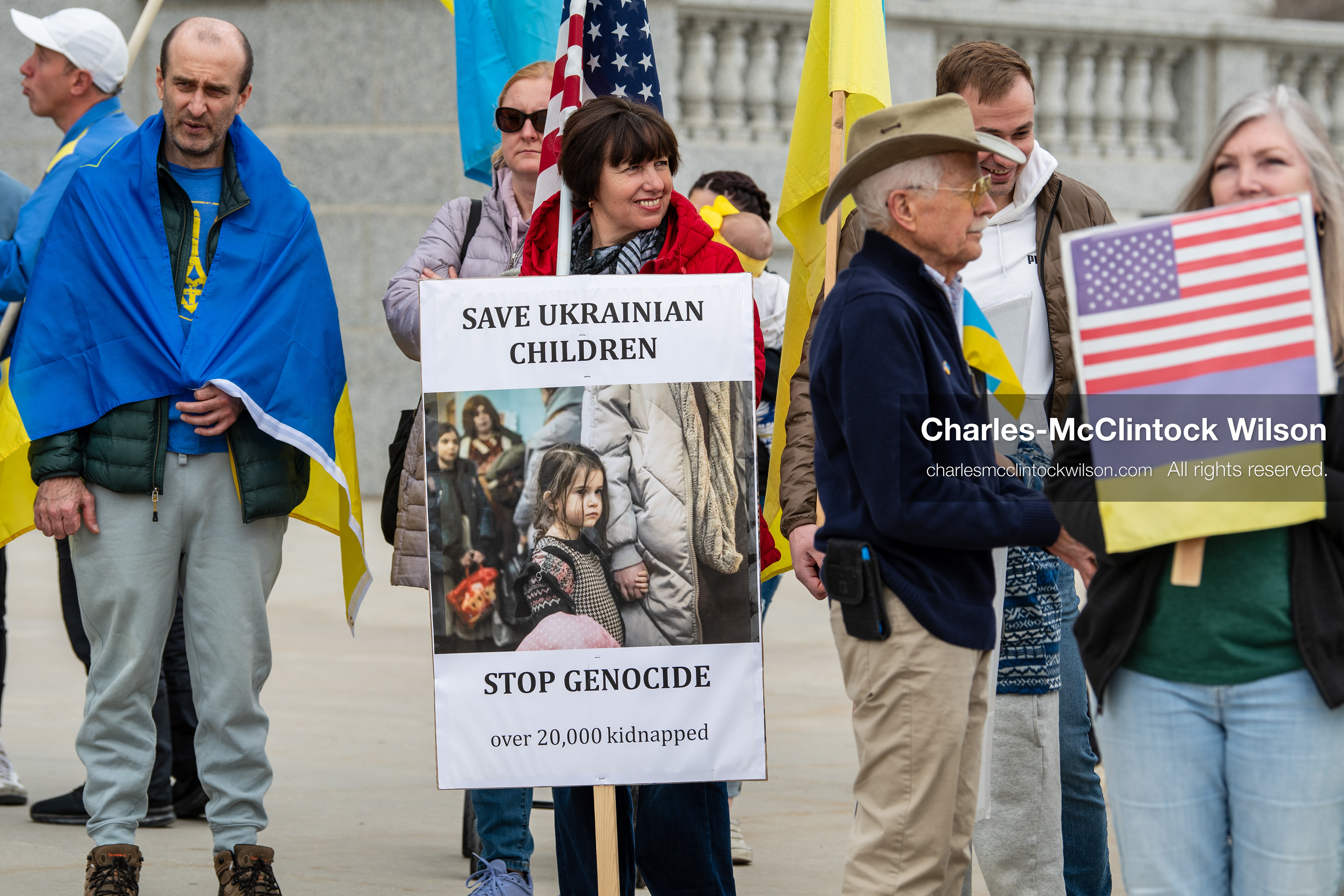 February 28, 2026, Salt Lake City, Utah, USA: Demonstrators gather on the steps near the Utah State Capitol during the Stand With Ukraine rally, holding American and Ukrainian flags along with a sign reading Peace With Honor Equals Victory vs Tyranny Support Ukraine. The gathering marked the four year anniversary of the full scale Russian invasion of Ukraine and brought community members together in support of Ukrainians and local humanitarian efforts. (Credit Image: © Charles McClintock Wilson/ZUMA Press Wire)