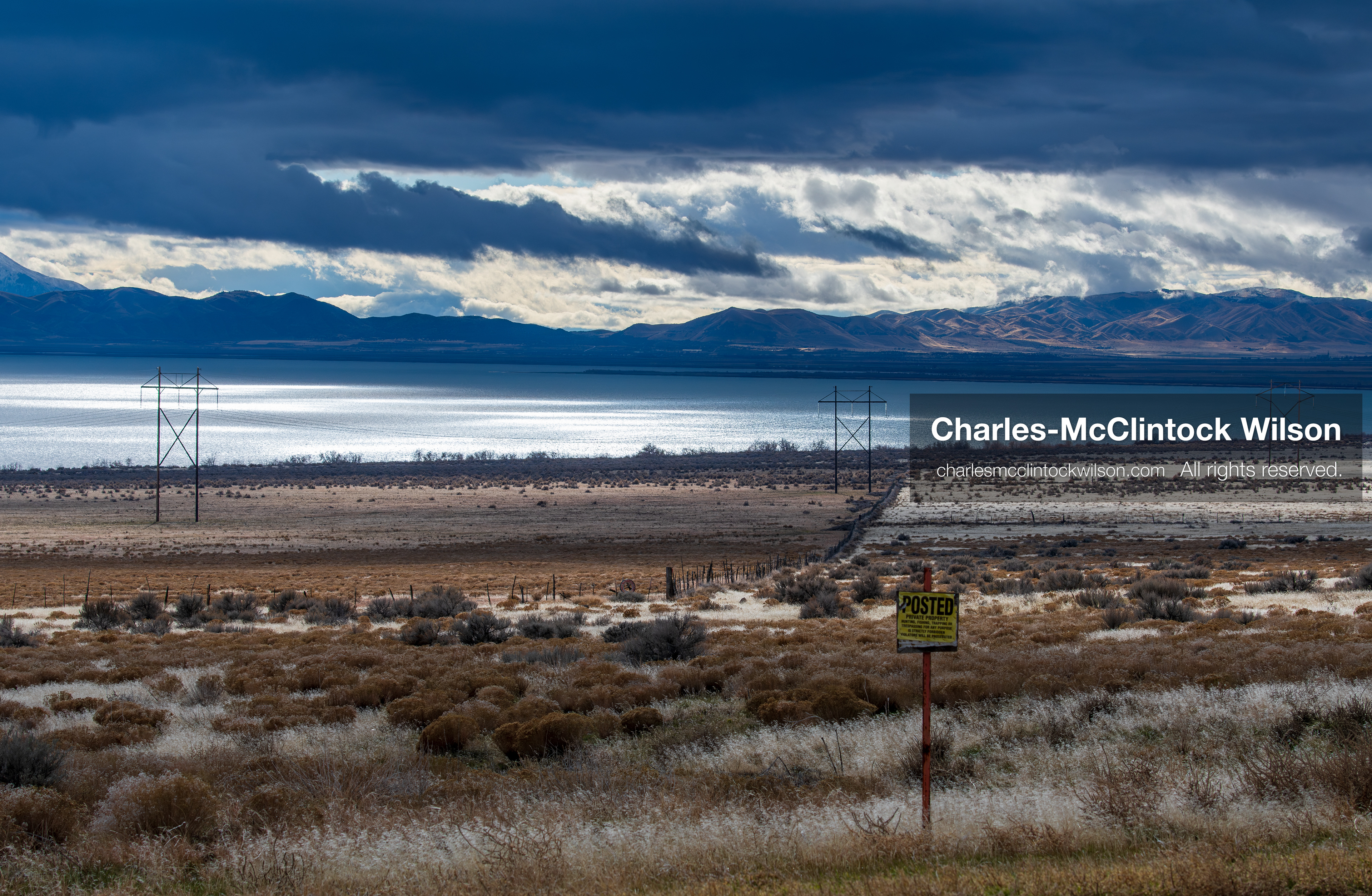 January 1, 2026, Saratoga Springs, Utah, USA: Utah Lake is seen under dramatic cloud cover on January 1, 2026, near Saratoga Springs, Utah, USA. Dry grass, power lines, and a posted sign frame the landscape as winter conditions settle across northern Utah. (Credit Image: © Charles-McClintock Wilson/ZUMA Press Wire)