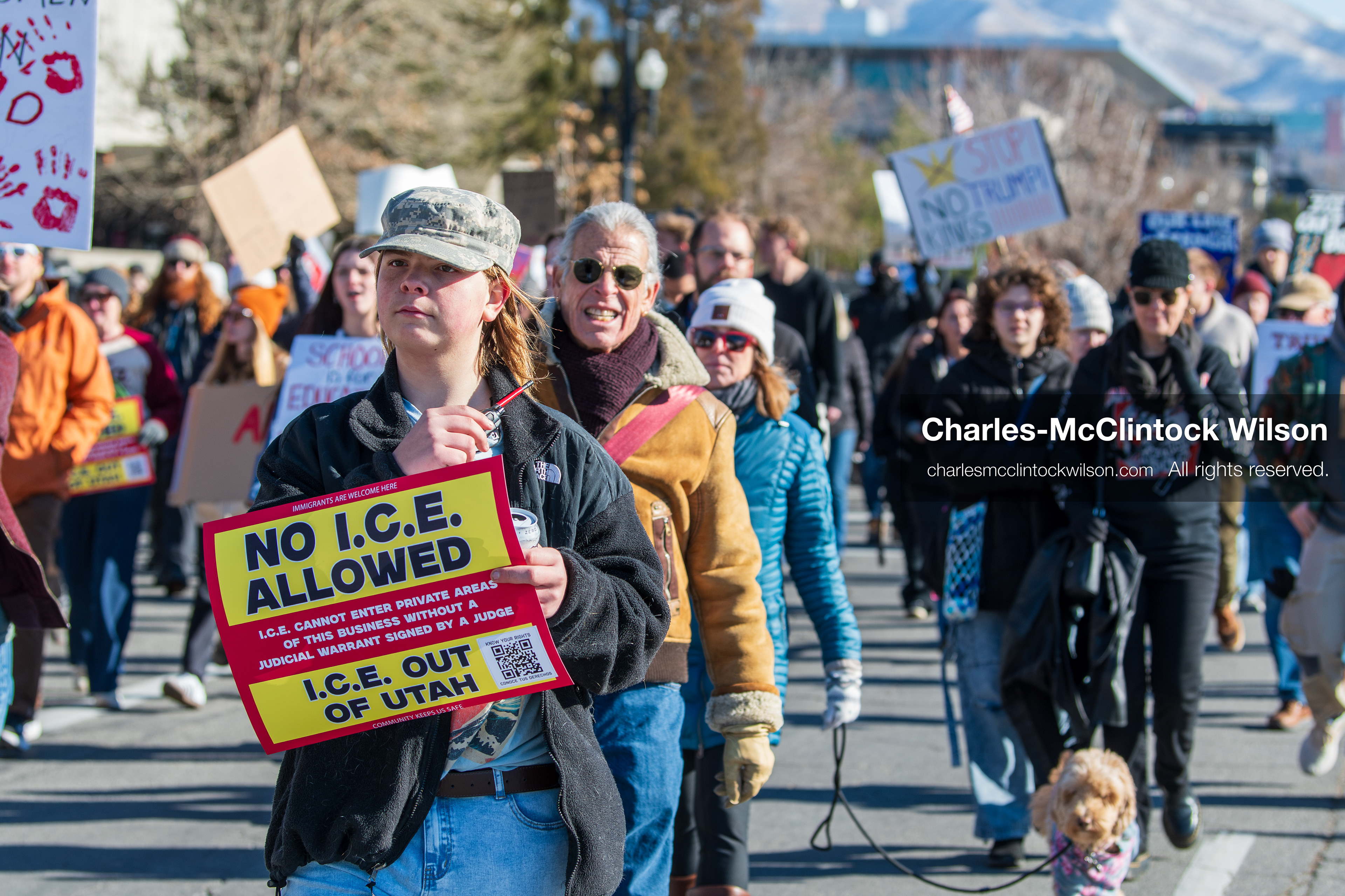 Salt Lake City, Utah, January 10, 2026: A group of demonstrators marches through downtown Salt Lake City during the ICE Out for Good protest, which began at Washington Square Park, with participants carrying signs and personal items as they walk together. (Credit Image: © Charles‑McClintock Wilson/ZUMA Press Wire)
