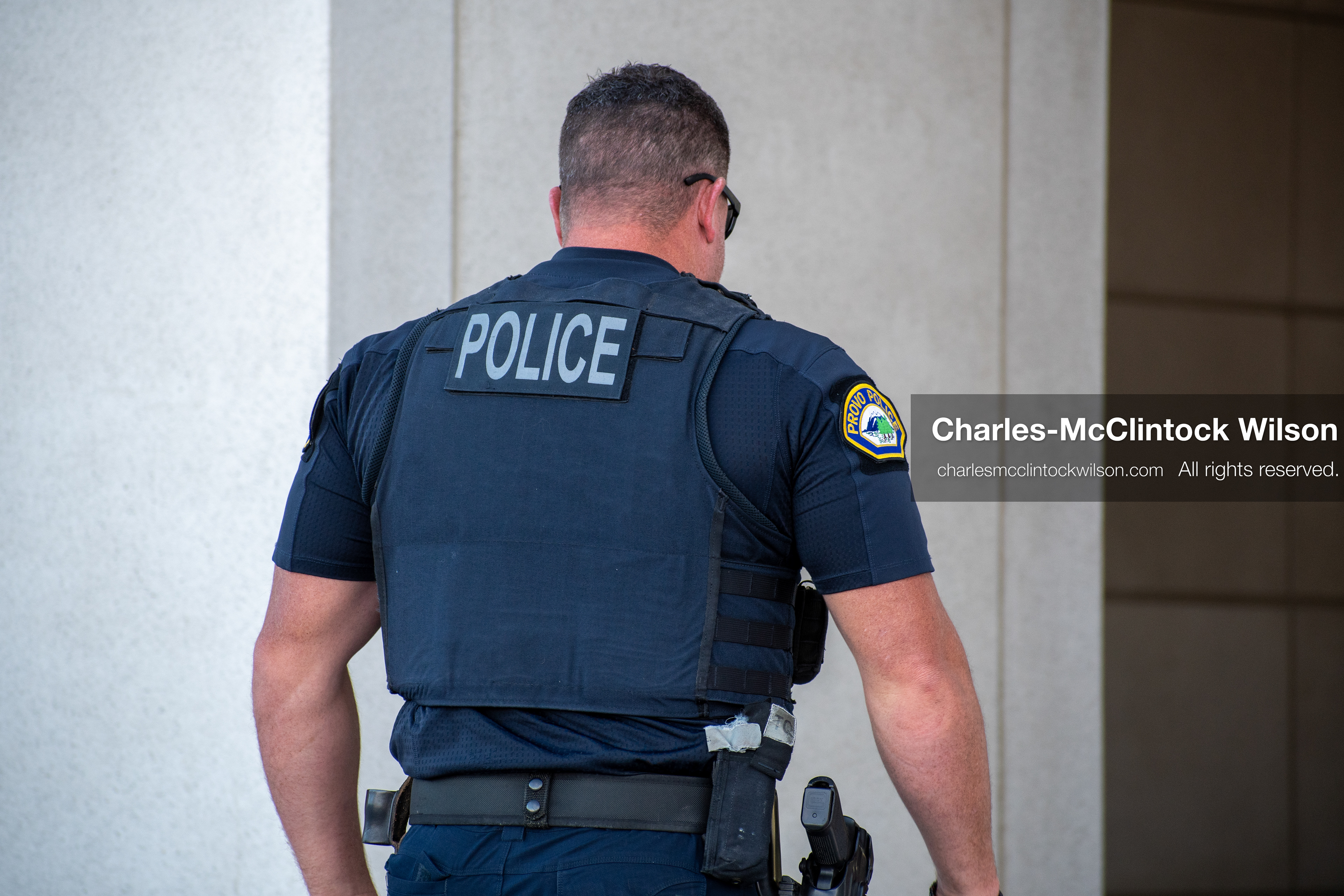 SEPTEMBER 29, 2025 — PROVO, UTAH, USA: A Provo Police Department officer walks outside the Utah County Court during a waiver hearing for Tyler Robinson. Robinson, charged with aggravated murder in the September 10 shooting death of conservative activist Charlie Kirk at Utah Valley University, appeared virtually for the proceedings. Law enforcement maintained a visible presence throughout the hearing. (Credit Image: © Charles‑McClintock Wilson / ZUMA Press Wire)