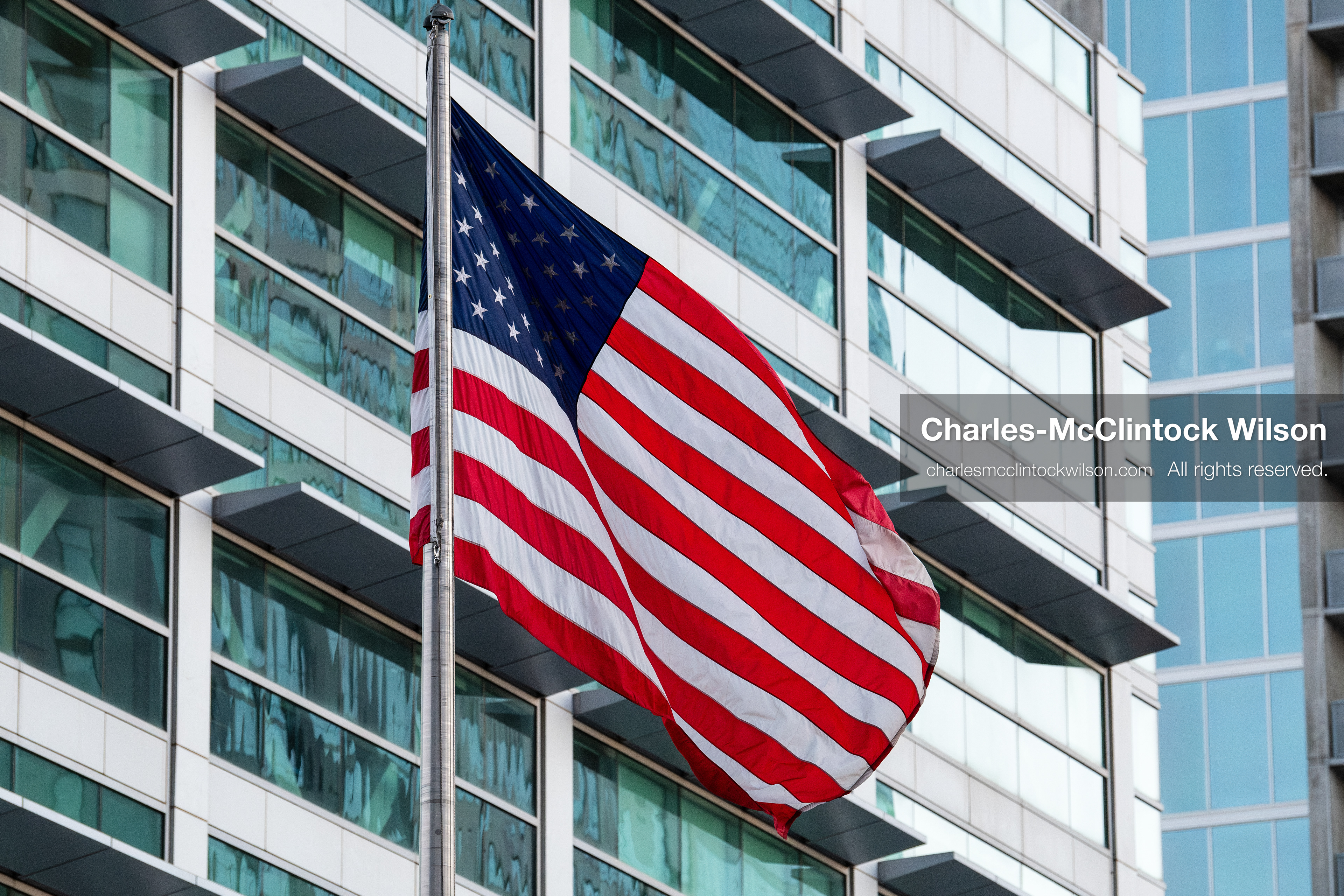 January 5, 2026, Salt Lake City, Utah, USA: The US flag flies outside the Wallace Federal Building during a protest on January 5, 2026. The rally, organized by Salt Lake Indivisible, called for congressional limits on presidential war powers following recent US military actions in Venezuela involving the government of Nicolas Maduro. Attendees signed petitions addressed to Utah US senators Mike Lee and John Curtis. (Credit Image: (c) Charles‑McClintock Wilson/ZUMA Press Wire)
