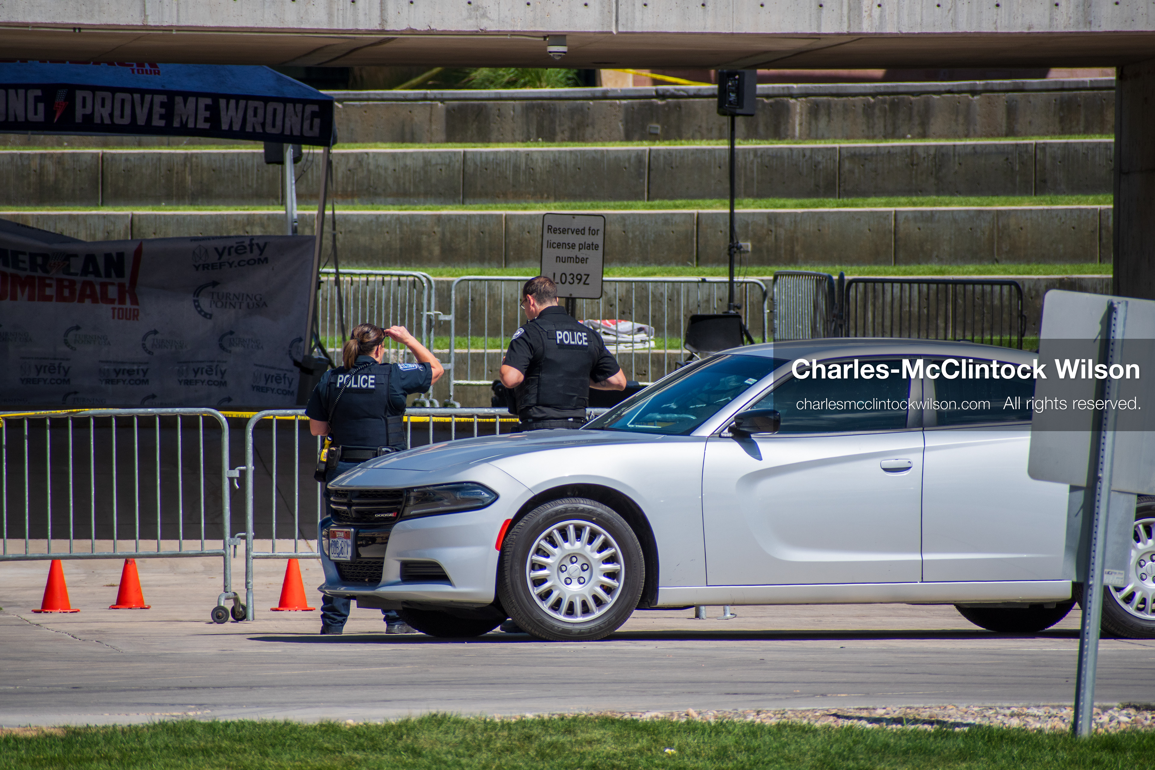 September 12, 2025, Orem, Utah, USA: Investigators and police officers secure the canopy-covered courtyard at Utah Valley University in Orem, Utah, where conservative activist CHARLIE KIRK was fatally shot during a public speaking event on September 10, 2025. KIRK, CEO of Turning Point USA, was seated beneath the canopy when a single bullet struck him in the neck.   (Credit Image: © Charles‑McClintock Wilson/ZUMA Press Wire)