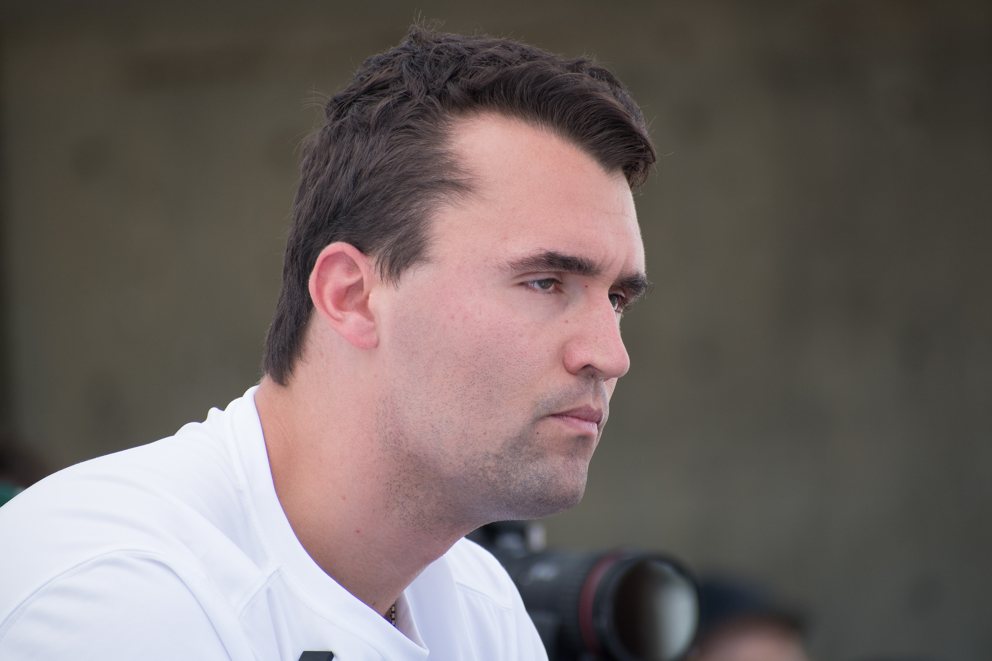 OREM, UTAH – SEPTEMBER 10, 2025: Charlie Kirk appears focused and resolute during a public event at Utah Valley University. Captured in a moment of quiet intensity, Kirk looks off-camera as media lenses track his movements. The image reflects the tension and conviction that defined his final public appearance before the shooting incident that disrupted the event. © Charles-McClintock Wilson / ZUMA Press 