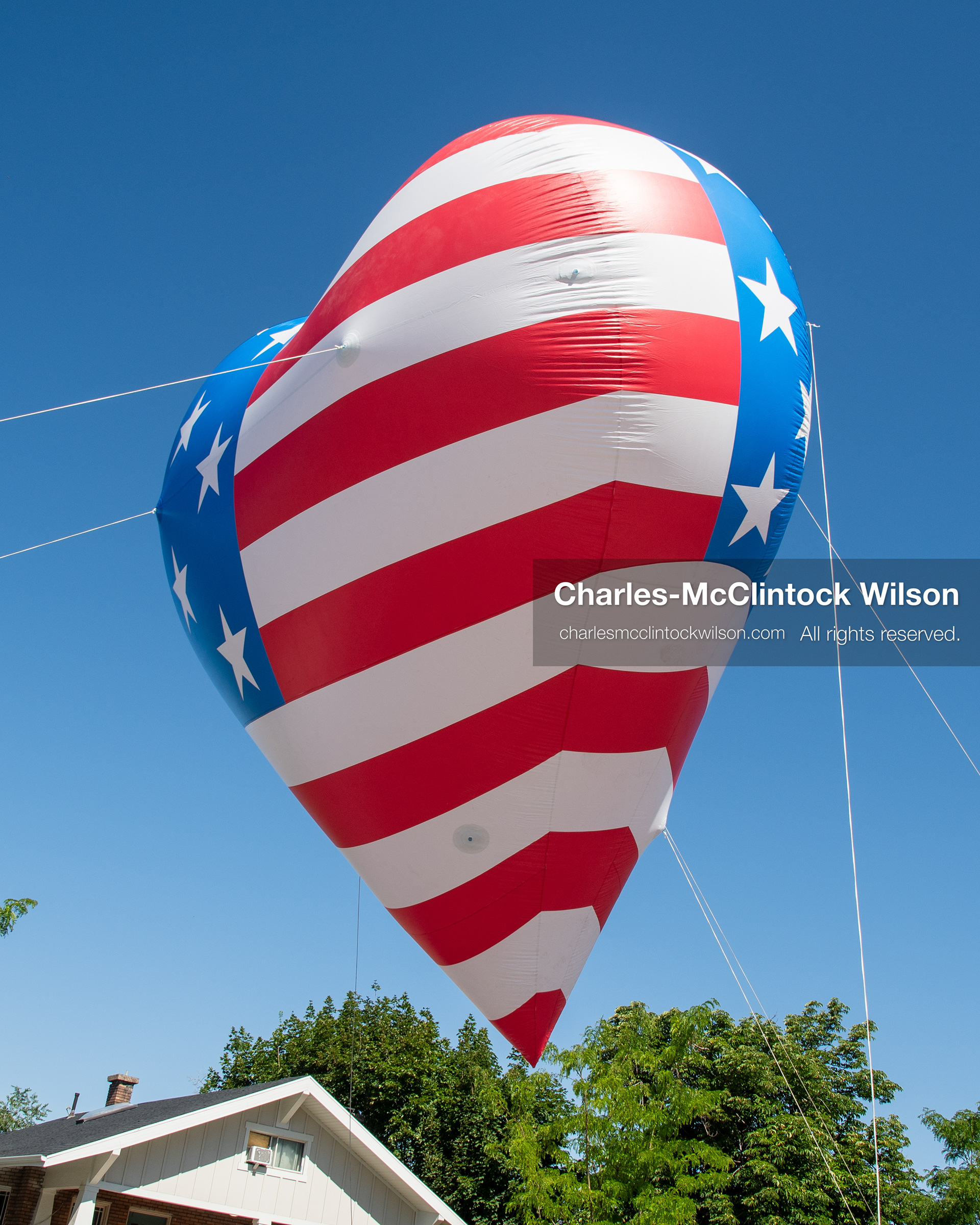 July 4, 2026, Provo, Utah, USA: A giant, heart-shaped helium balloon decorated with an American flag pattern floats overhead during America's Freedom Festival Grand Parade in Provo, Utah, Saturday, July 4, 2026. The annual Independence Day event features expanded programming to honor the 250th anniversary of United States independence. (Credit Image: © Charles-McClintock Wilson/ZUMA Press Wire)
