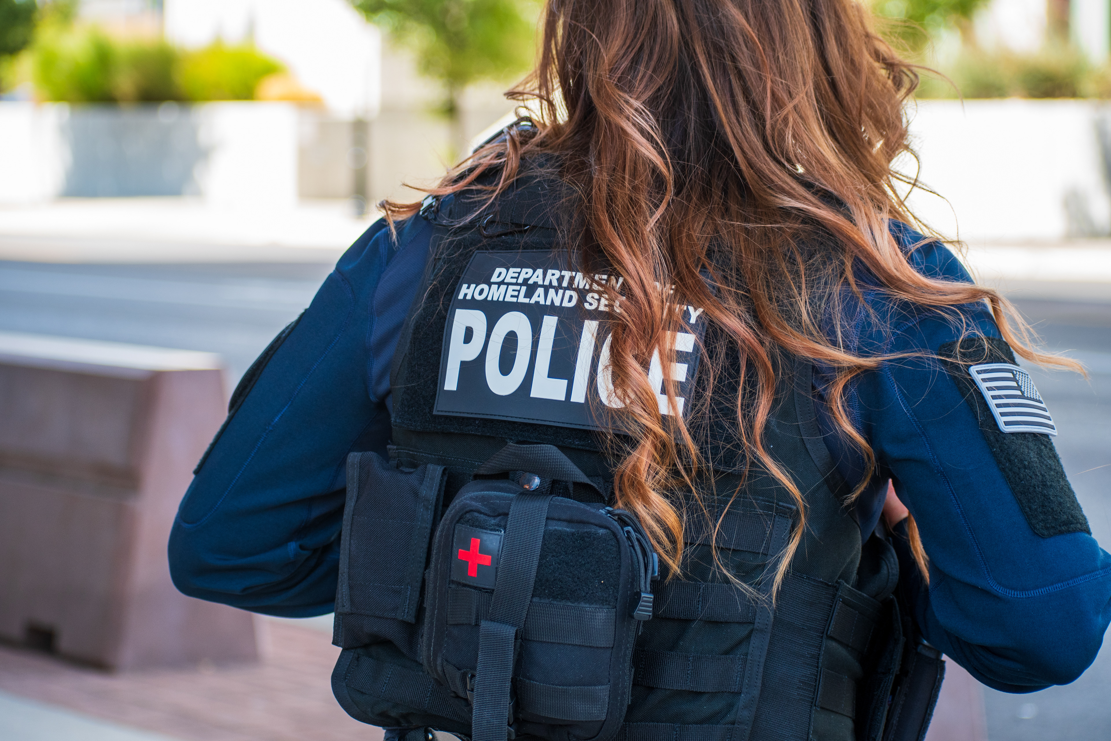 A Homeland Security police officer walks near the Utah Valley Convention Center during a Department of Homeland Security career expo focused on recruiting law enforcement and security personnel. Photograph by Charles‑McClintock Wilson / ZUMA Press Wire