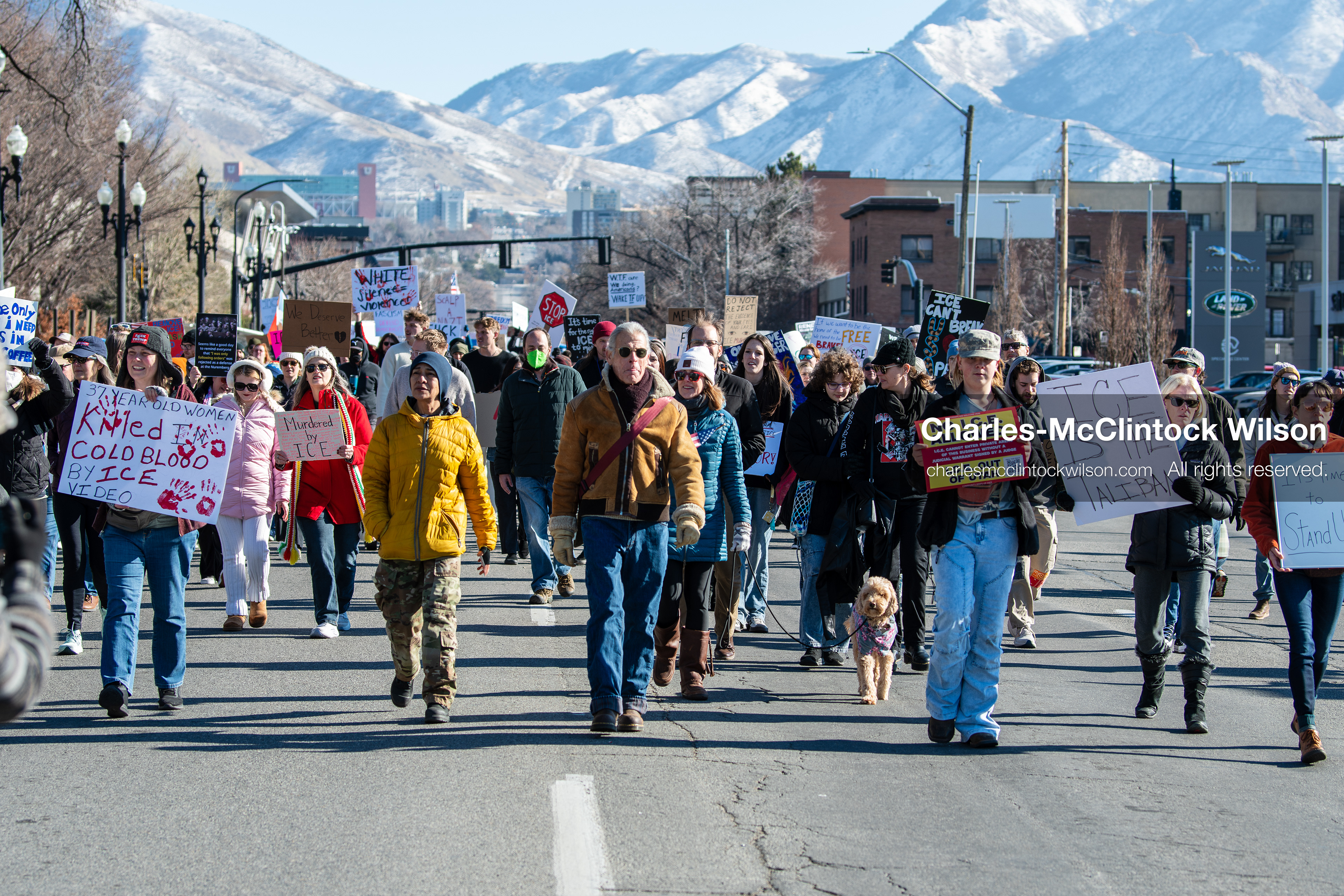 Salt Lake City, Utah, January 10, 2026: A group of demonstrators marches through downtown Salt Lake City during the ICE Out for Good protest, which began at Washington Square Park, with participants carrying signs and personal items as they walk together. (Credit Image: © Charles‑McClintock Wilson/ZUMA Press Wire)