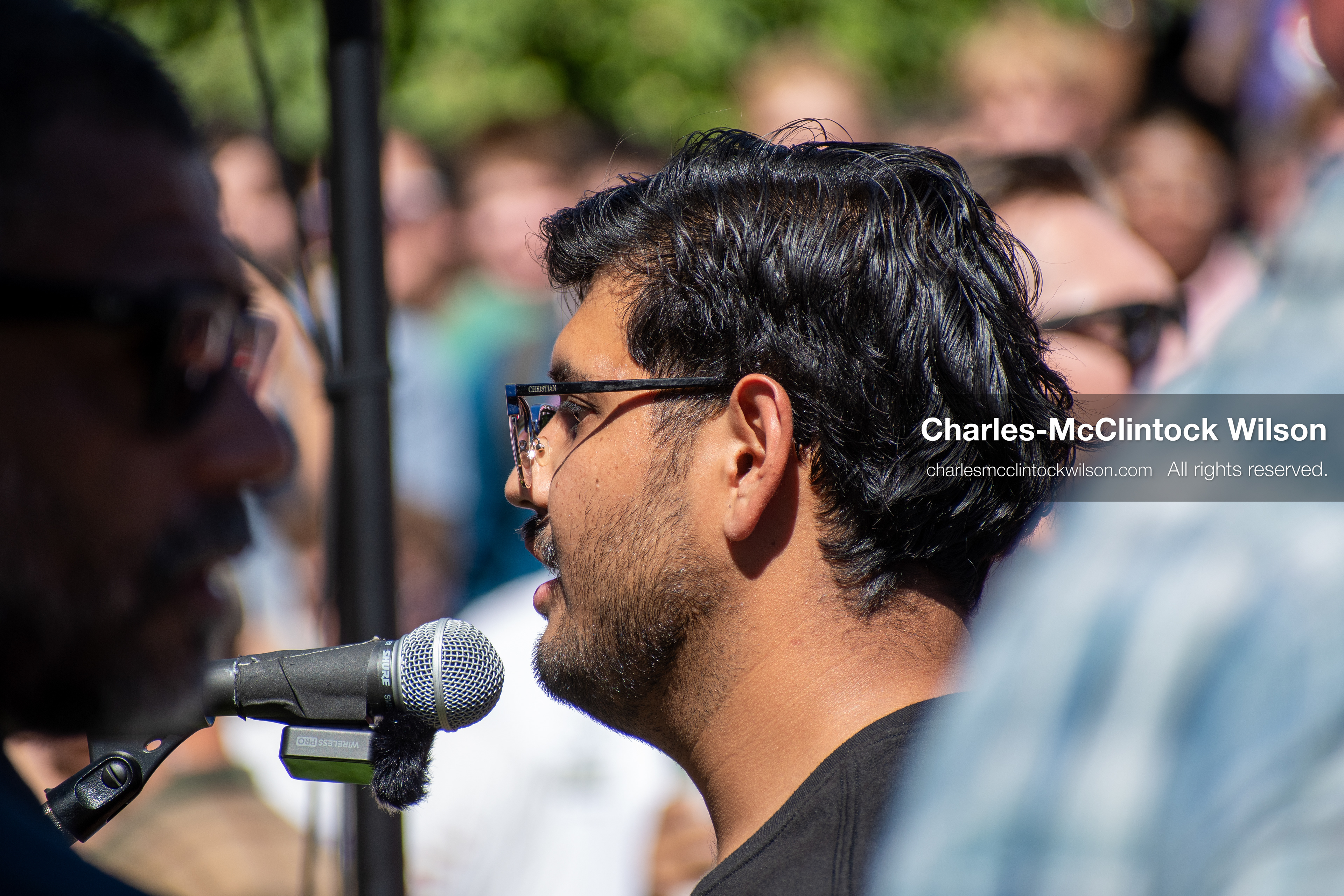 September 10, 2025, Orem, Utah, USA: A member of the audience speaks into a microphone during conservative activist Charlie Kirk’s American Comeback Tour appearance at Utah Valley University. The event was held outdoors at the Fountain Courtyard, where Kirk had requested a central, visible location. This individual was the first to ask Kirk a question during the public Q&A session, moments before Kirk was fatally shot by a sniper positioned on a nearby rooftop. The incident drew national attention and prompted scrutiny of campus security protocols. (Credit Image: © Charles‑McClintock Wilson/ZUMA Press Wire)