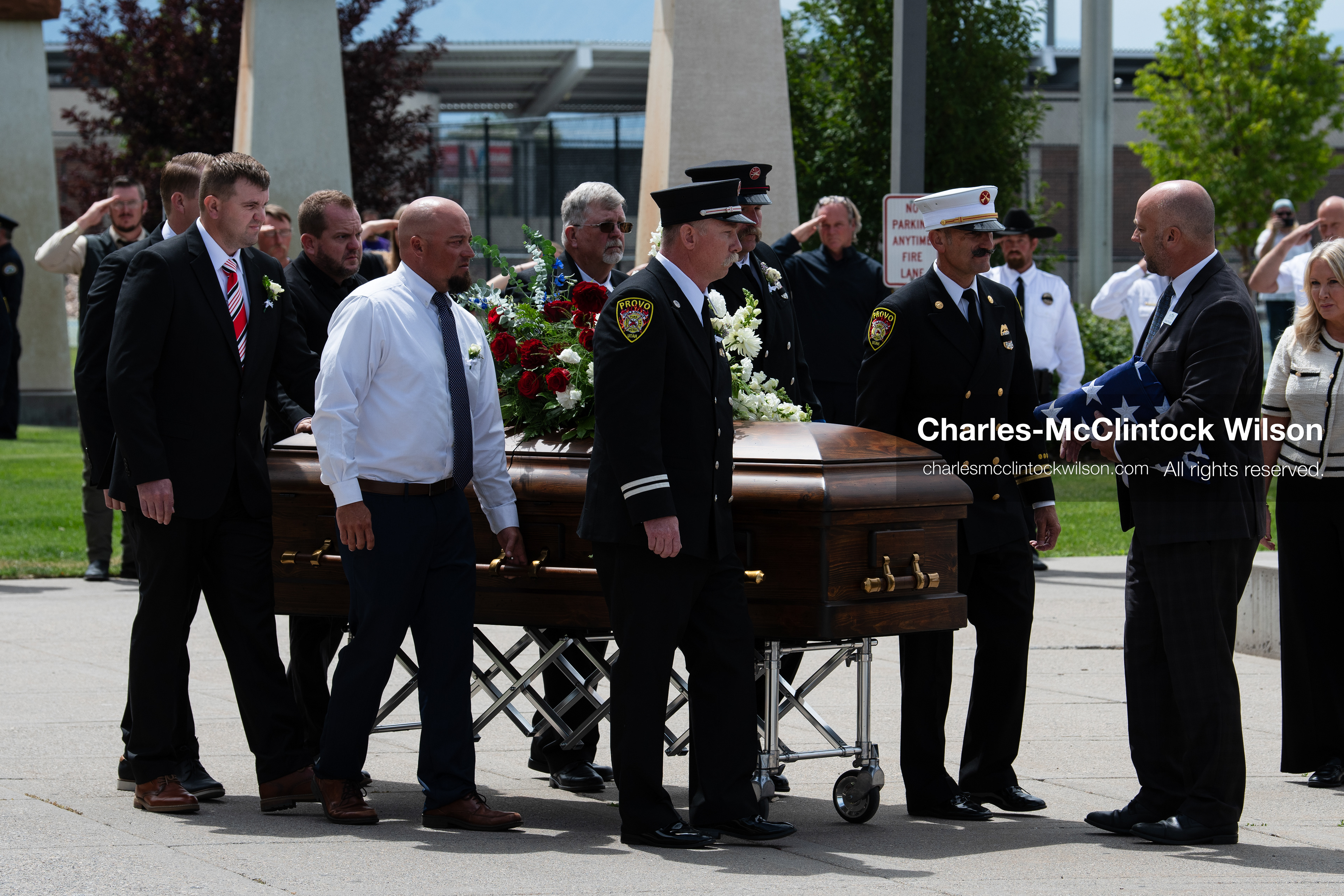 Firefighters and pallbearers escort the casket of Provo Fire Captain Spencer Long outside the UCCU Center on the campus of Utah Valley University in Orem, Utah, on Wednesday, July 29, 2026. More than 300 people came to the public memorial ceremony to honor Captain Long, his wife Katrina, and three of their sons, who died after a flash flood hit their campsite near the Sunglow Campground in Wayne County. (Photo by Charles-McClintock Wilson/Sipa USA)