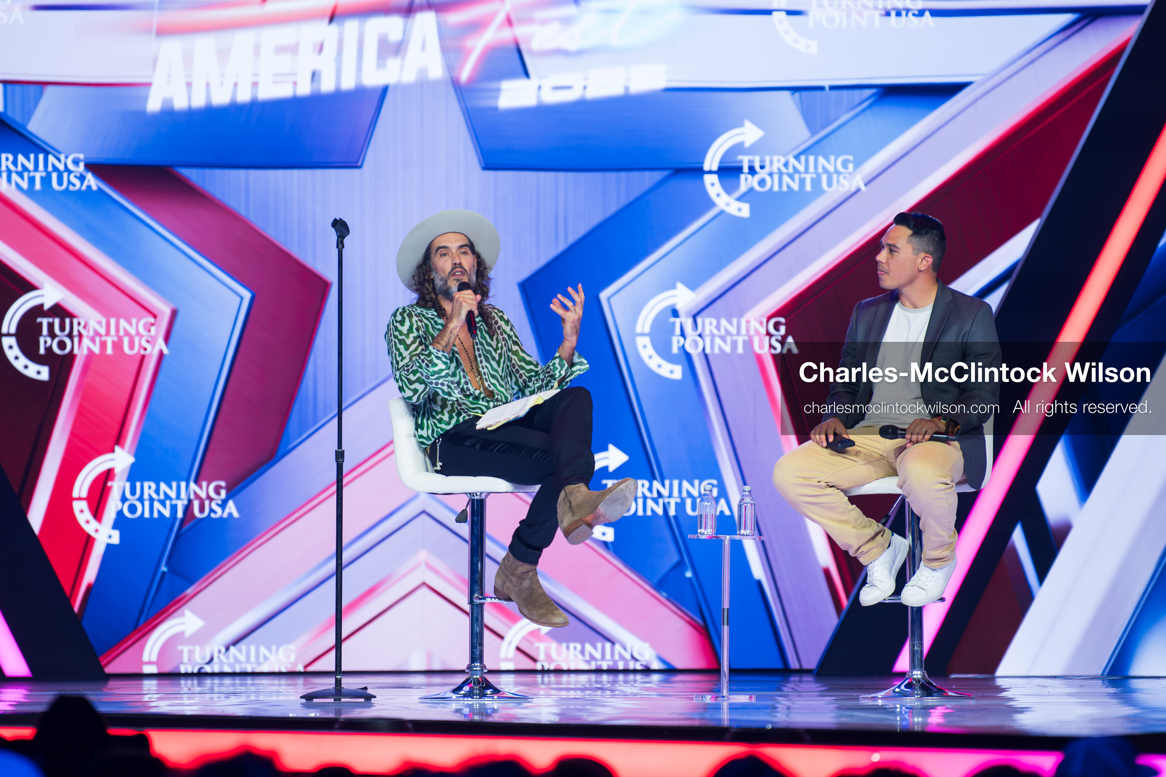 December 18, 2025, Phoenix, Arizona, USA: Russell Brand speaks during Day One of Turning Point USA’s AmericaFest 2025 at the Phoenix Convention Center in Phoenix, Arizona.   (Credit Image: © Charles‑McClintock Wilson/ZUMA Press Wire)