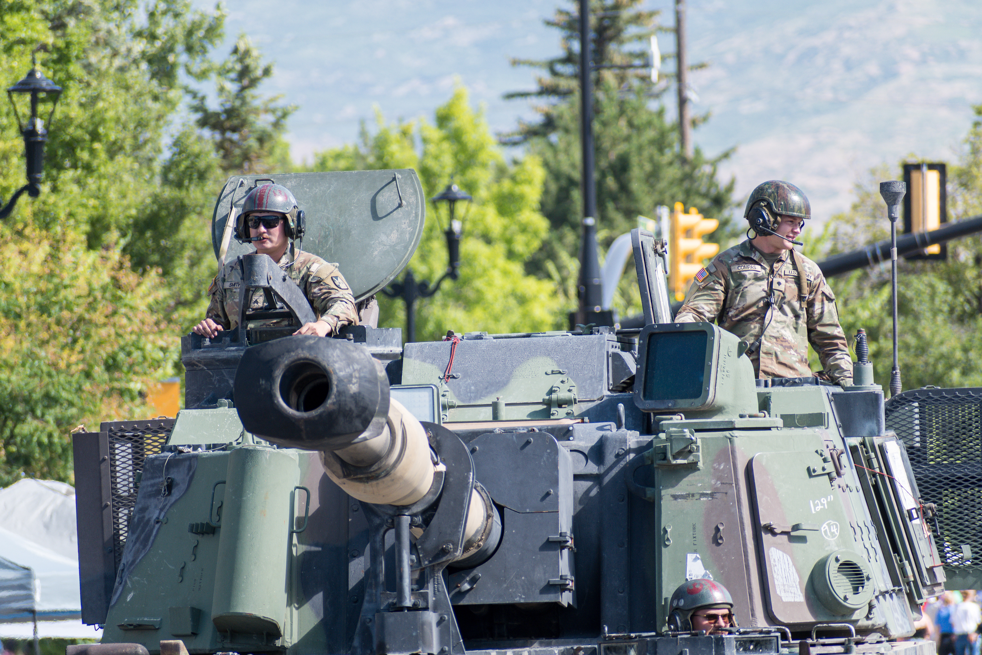 Provo, Utah – July 4, 2025: U.S. Army personnel ride atop a military vehicle during the Freedom Festival Grand Parade, honoring service and adding a patriotic presence to the Independence Day.