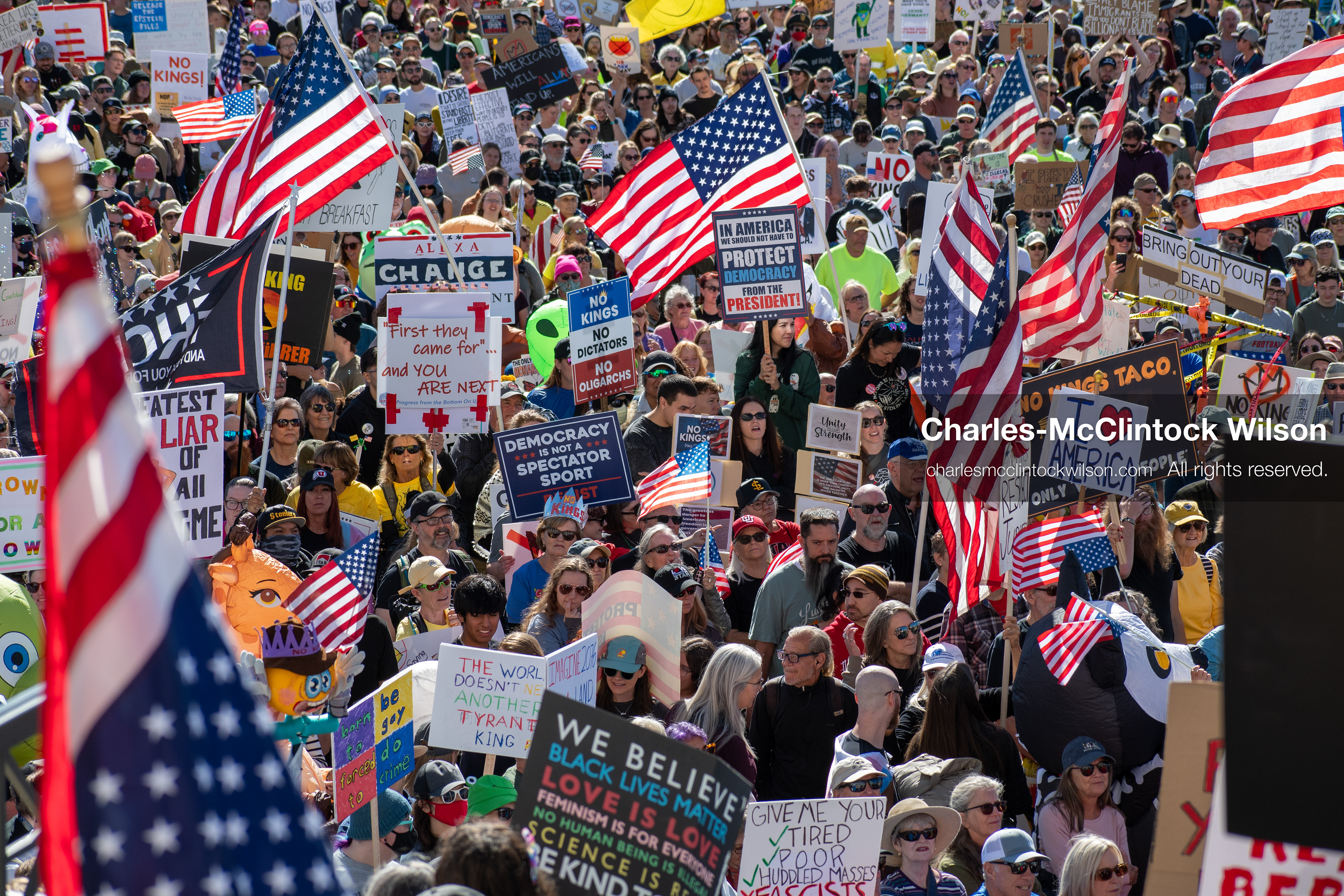 October 18, 2025, Salt Lake City, Utah, USA: Demonstrators participate in a "No Kings" protest held at the Utah State Capitol. Participants hold signs and flags during the public gathering.