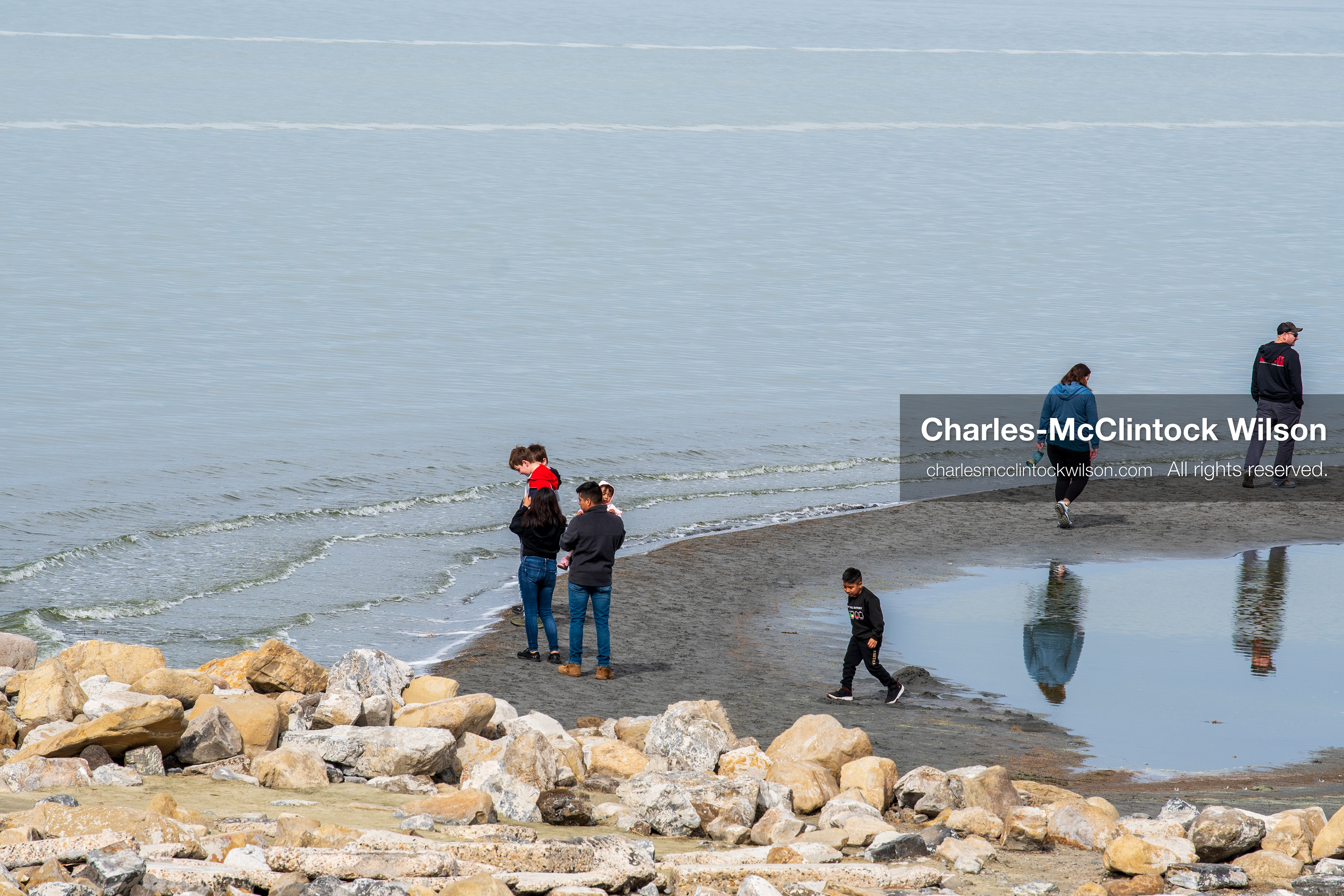 March 1, 2026, Great Salt Lake, Utah, USA: People walk along the shoreline of the Great Salt Lake as water levels remain historically low. Reports from state officials and the Great Salt Lake Strike Team state that the lake continues to fall within a serious adverse‑effects range, with elevations among the lowest recorded in more than one hundred years. The lake has drawn increased public attention as lawmakers consider large‑scale water projects and long‑term plans to address declining conditions. (Credit Image: © Charles‑McClintock Wilson/ZUMA Press Wire)