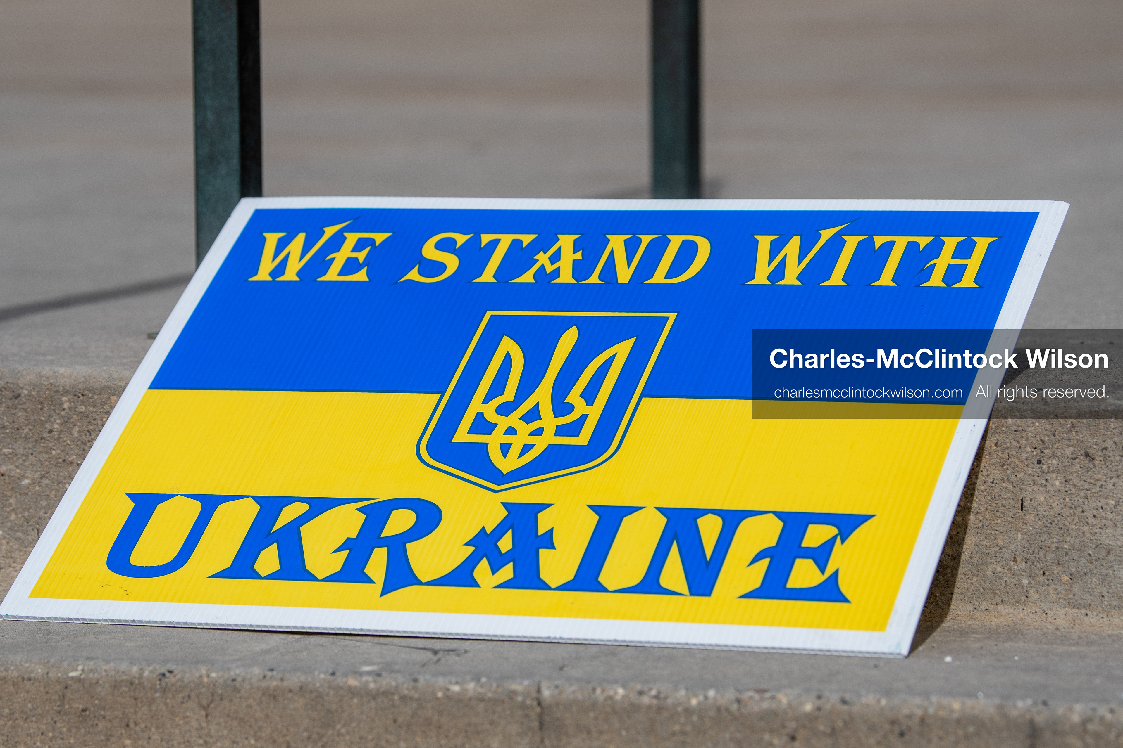 February 28, 2026, Salt Lake City, Utah, USA: A sign reading We Stand With Ukraine in the colors of the Ukrainian flag rests against a railing during the Stand With Ukraine rally at the Utah State Capitol. The gathering marked the four year anniversary of the full scale Russian invasion of Ukraine and brought community members together in support of Ukrainians and local humanitarian efforts. (Credit Image: © Charles McClintock Wilson/ZUMA Press Wire)