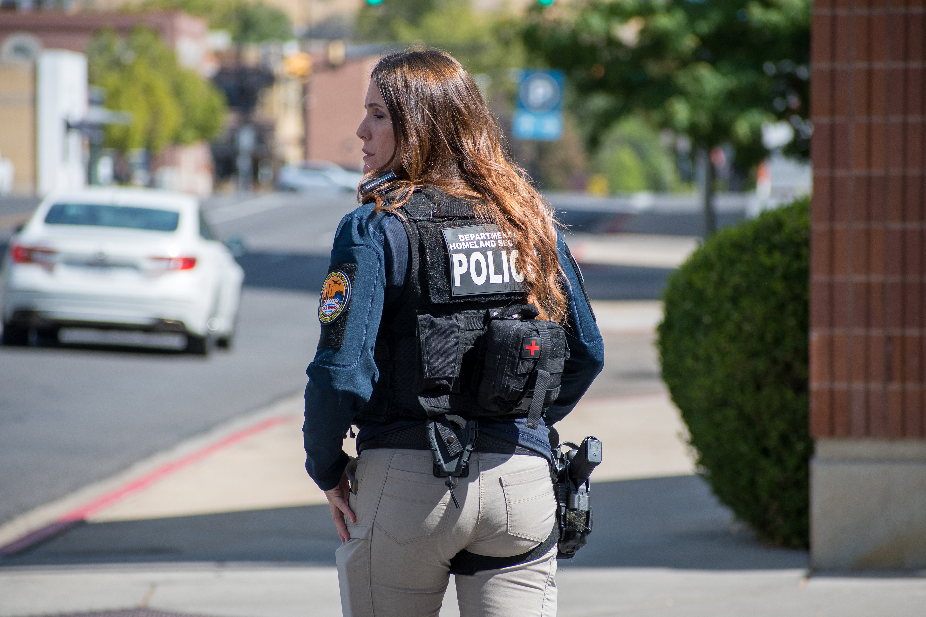 A Homeland Security police officer walks near the Utah Valley Convention Center during a Department of Homeland Security career expo focused on recruiting law enforcement and security personnel. Photograph by Charles‑McClintock Wilson / ZUMA Press Wire