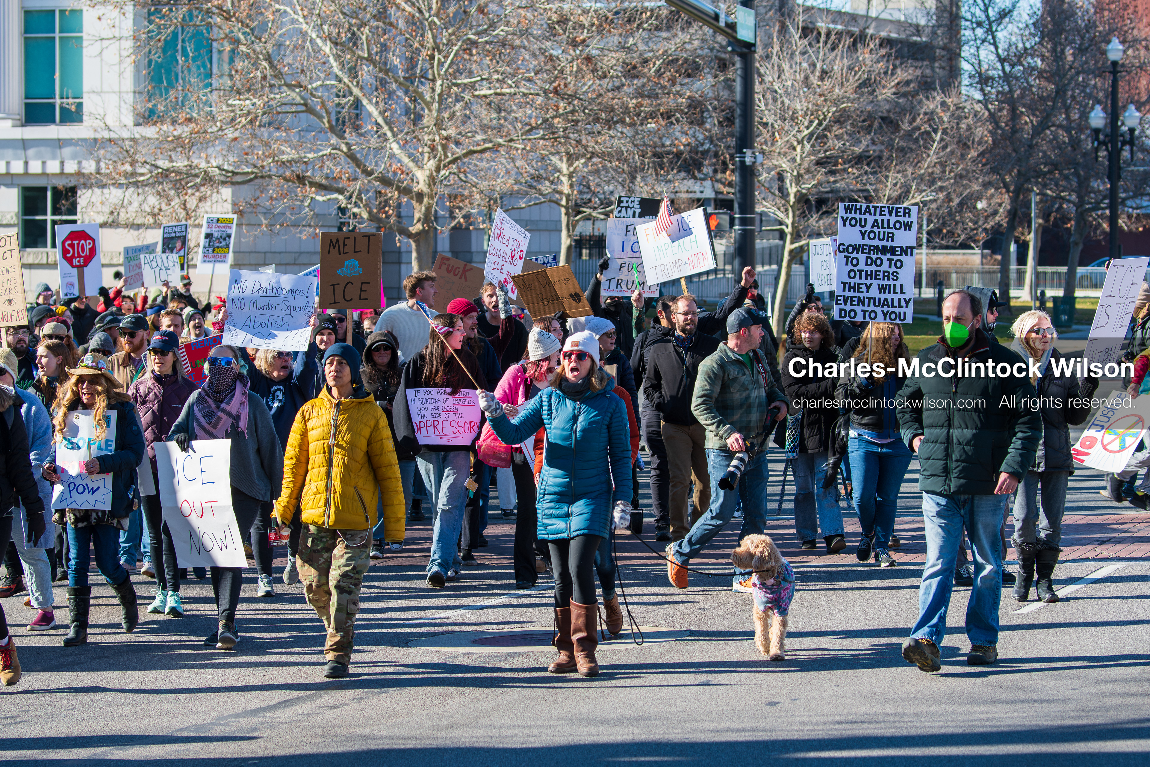 Salt Lake City, Utah, January 10, 2026: A group of demonstrators marches through downtown Salt Lake City during the ICE Out for Good protest, which began at Washington Square Park, with participants carrying signs and personal items as they walk together. (Credit Image: © Charles‑McClintock Wilson/ZUMA Press Wire)