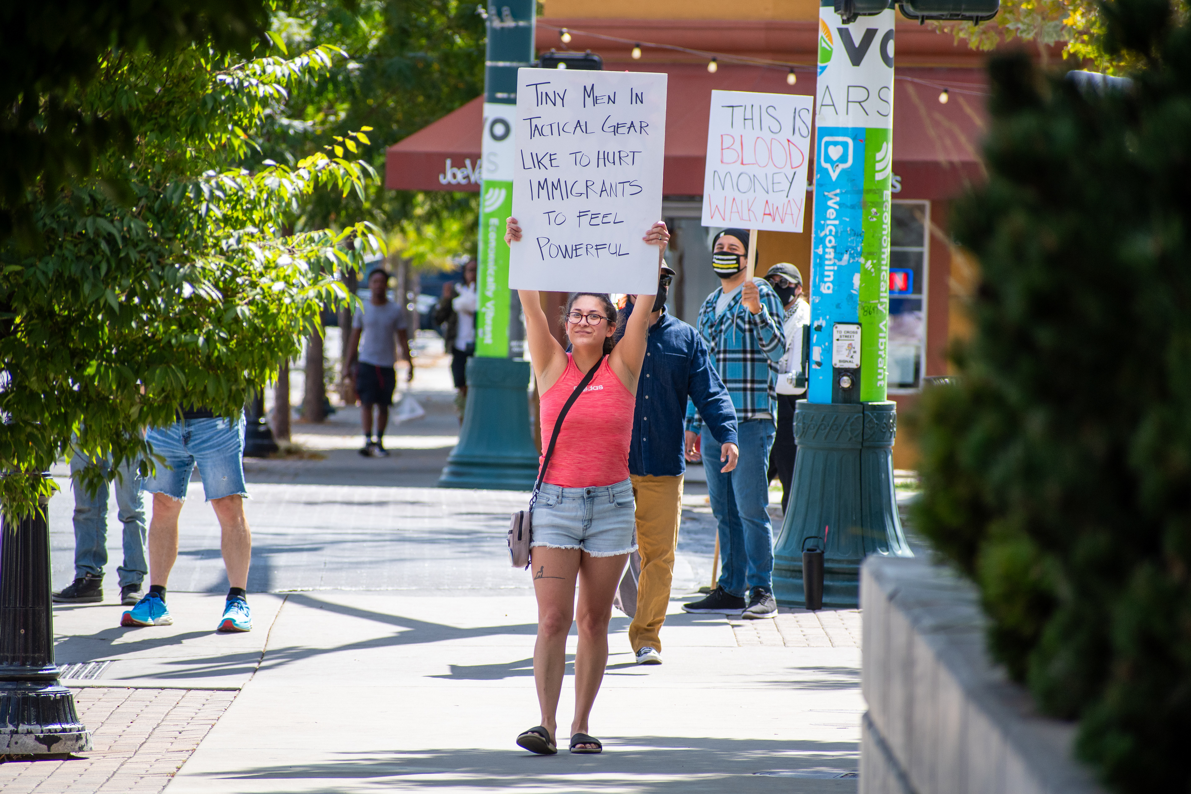 September 15, 2025 – Provo, Utah, United States: Demonstrators hold signs outside the Utah Valley Convention Center during a protest against the Department of Homeland Security career expo, voicing opposition to federal policing and immigration enforcement. Photograph by Charles‑McClintock Wilson / ZUMA Press Wire