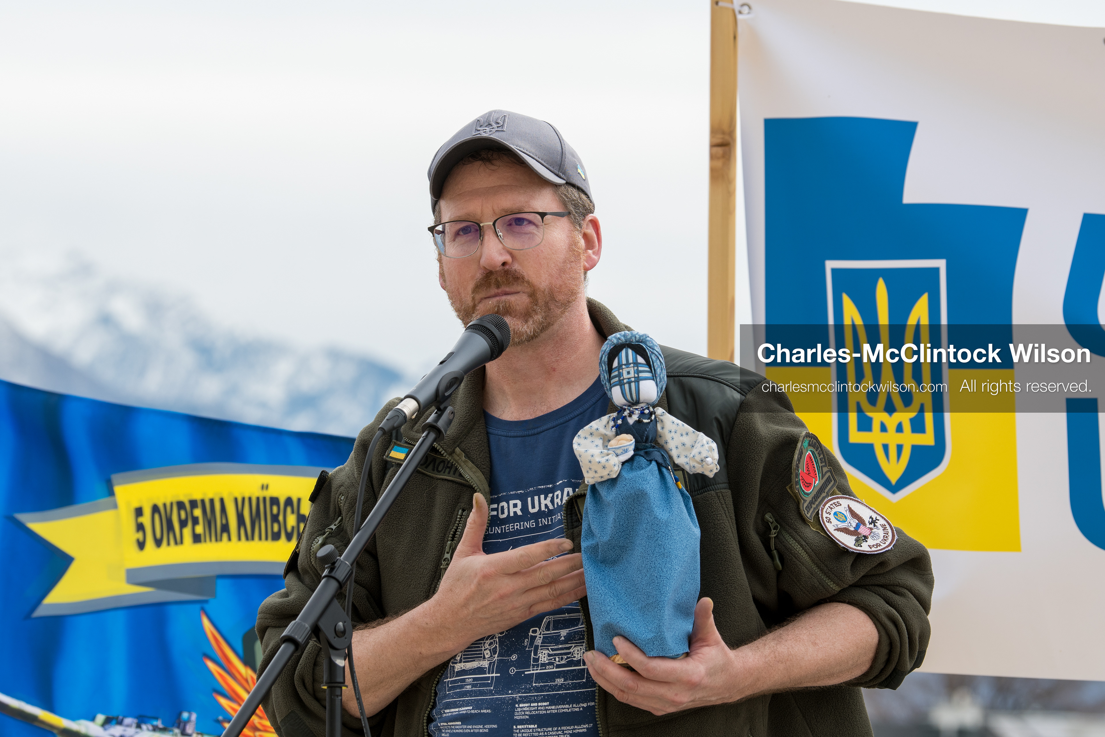 February 28, 2026, Salt Lake City, Utah, USA: NATHANIEL SANDERS, a Salt Lake County Deputy District Attorney and a vocal advocate for Ukraine, speaks while holding a traditional Ukrainian motanka doll, a handmade protective symbol, during the Stand With Ukraine rally at the Utah State Capitol. The event marked the four year anniversary of the full scale Russian invasion of Ukraine and brought community members together in support of Ukrainians and local humanitarian efforts. (Credit Image: © Charles McClintock Wilson/ZUMA Press Wire)