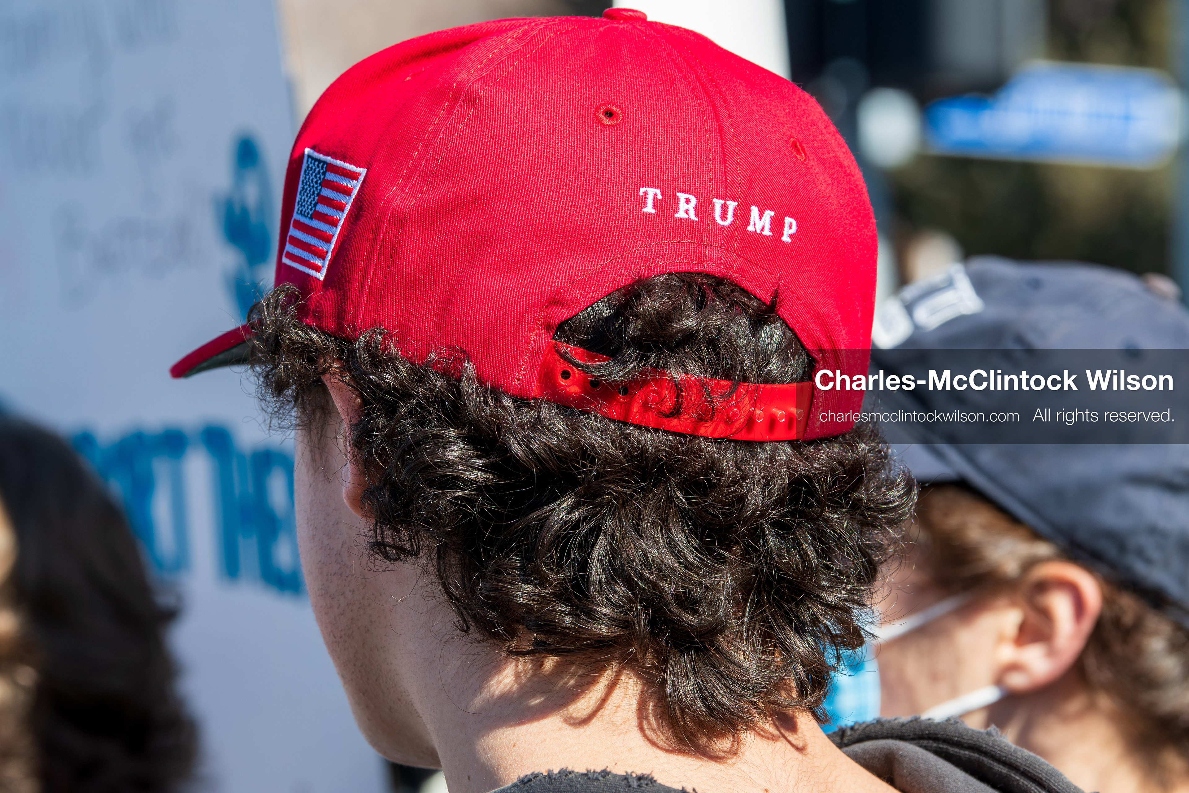 February 5, 2026, Provo, Utah, USA: A person wearing a red Make America Great Again hat stands among demonstrators near Brigham Young University in Provo during a gathering opposing the presence of US Customs and Border Protection recruiters at a career fair held on the BYU campus. (Credit Image: © Charles McClintock Wilson/ZUMA Press Wire)
