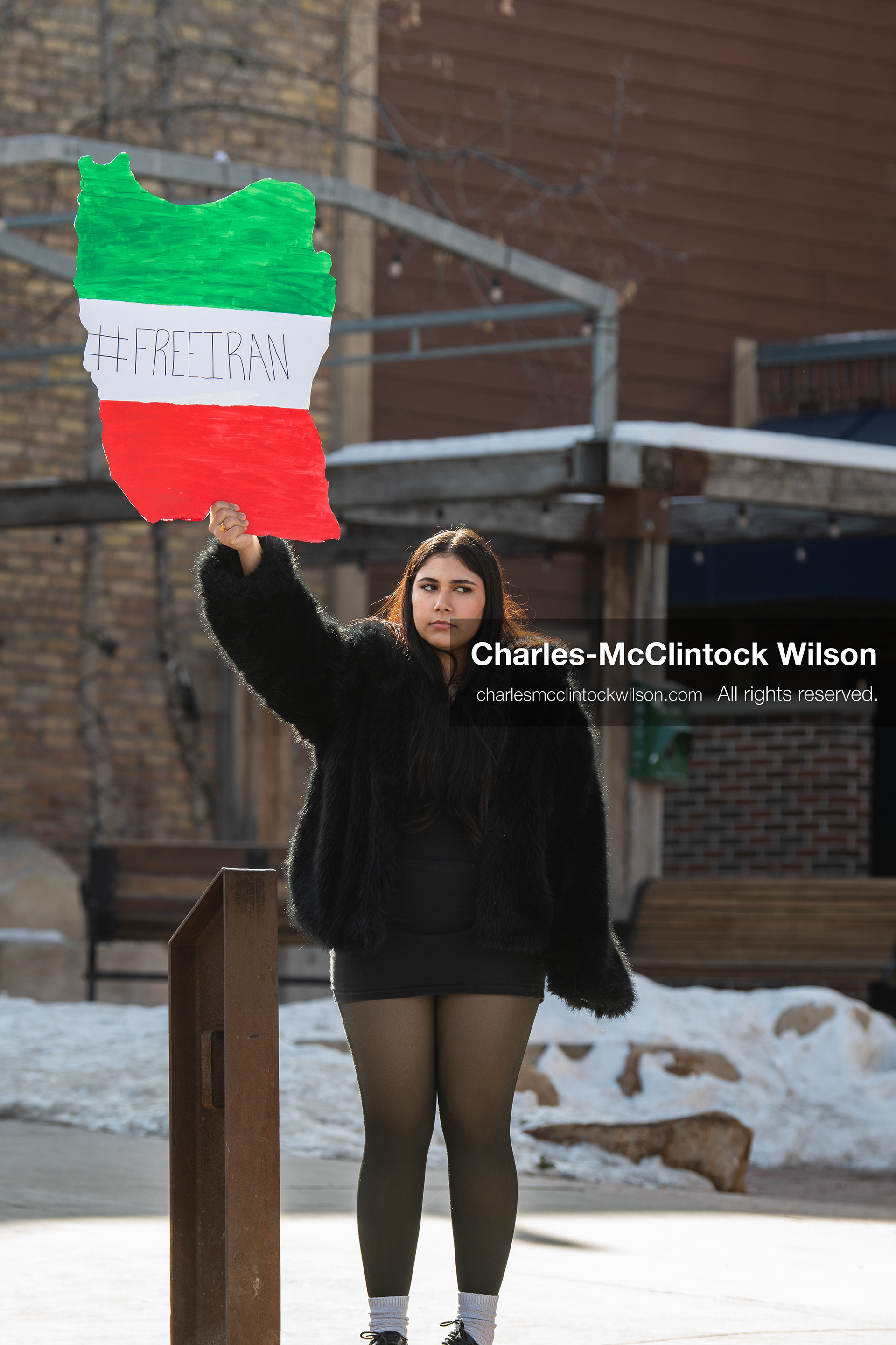 January 30, 2026, Park City, Utah, USA: A demonstrator holds a sign shaped like Iran during a small protest against the Iranian government on Main Street in Park City, Utah. (Credit Image: © Charles McClintock Wilson/ZUMA Press Wire)