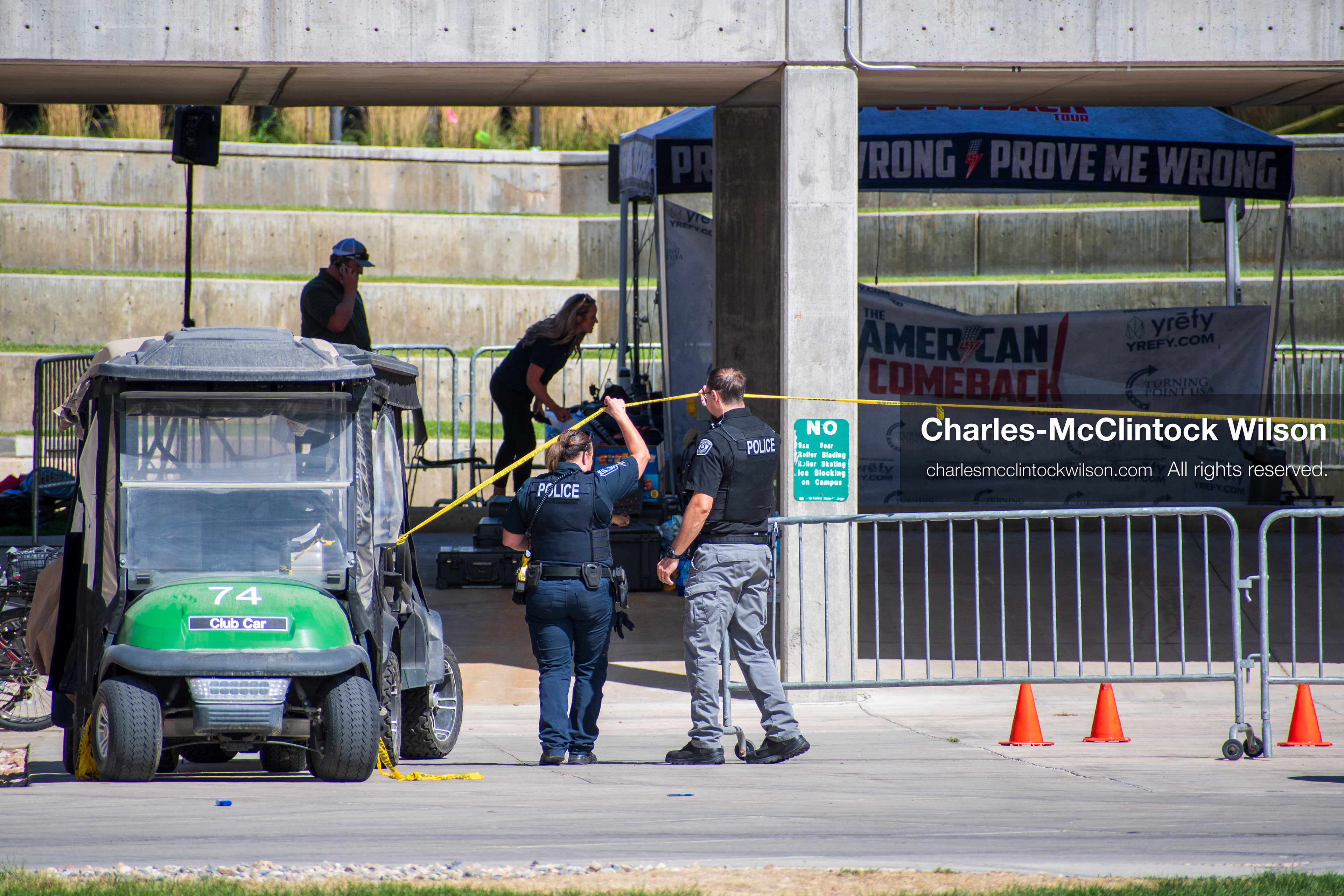 September 12, 2025, Orem, Utah, USA: Investigators and police officers secure the canopy-covered courtyard at Utah Valley University in Orem, Utah, where conservative activist CHARLIE KIRK was fatally shot during a public speaking event on September 10, 2025. KIRK, CEO of Turning Point USA, was seated beneath the canopy when a single bullet struck him in the neck.   (Credit Image: © Charles‑McClintock Wilson/ZUMA Press Wire)