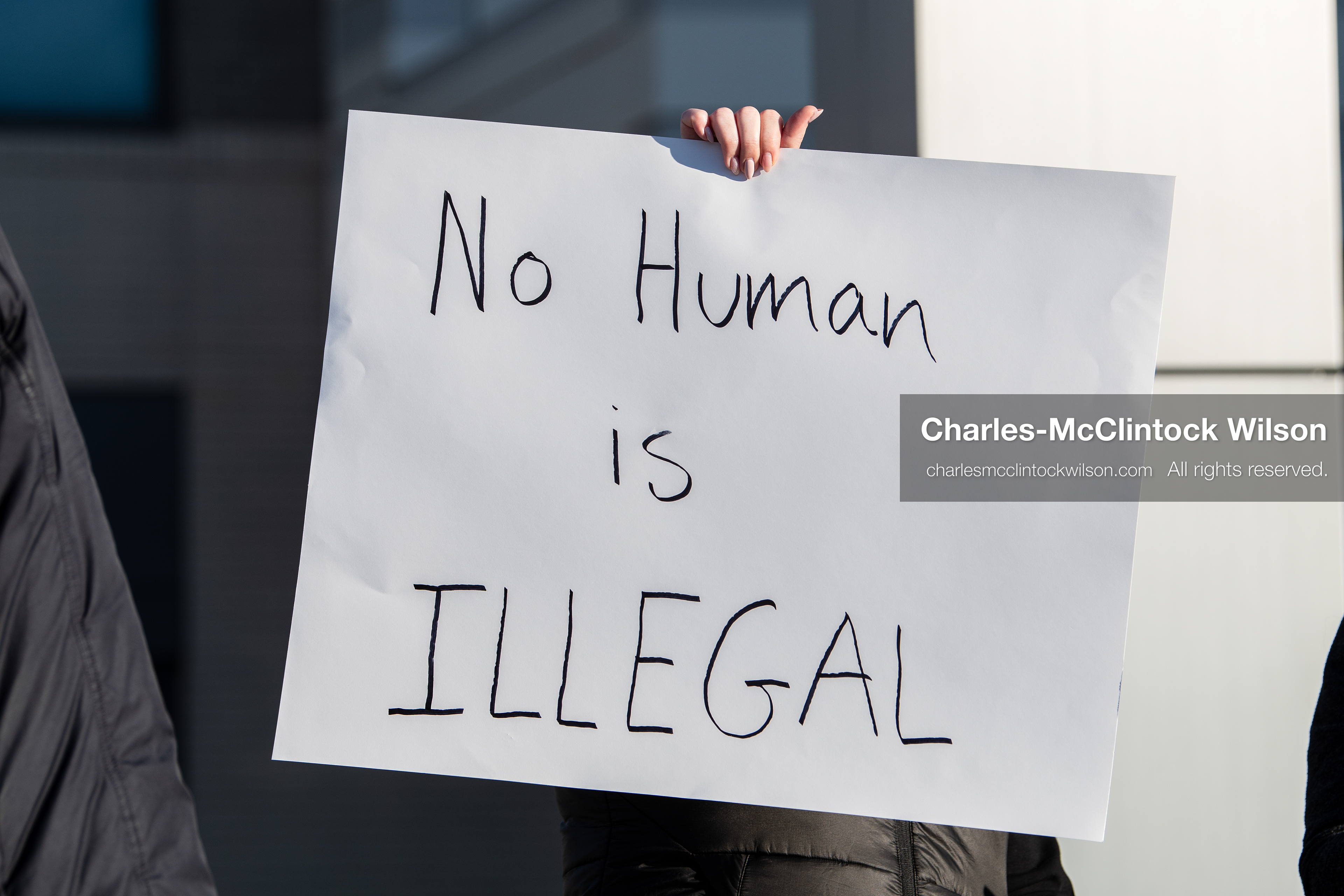  January 20, 2026, Provo, Utah, USA: A demonstrator stands outside Provo City Hall during the Free America Walkout protest in Provo Utah on January 20 2026. The nationwide event called for immigration reform and changes to detention practices.