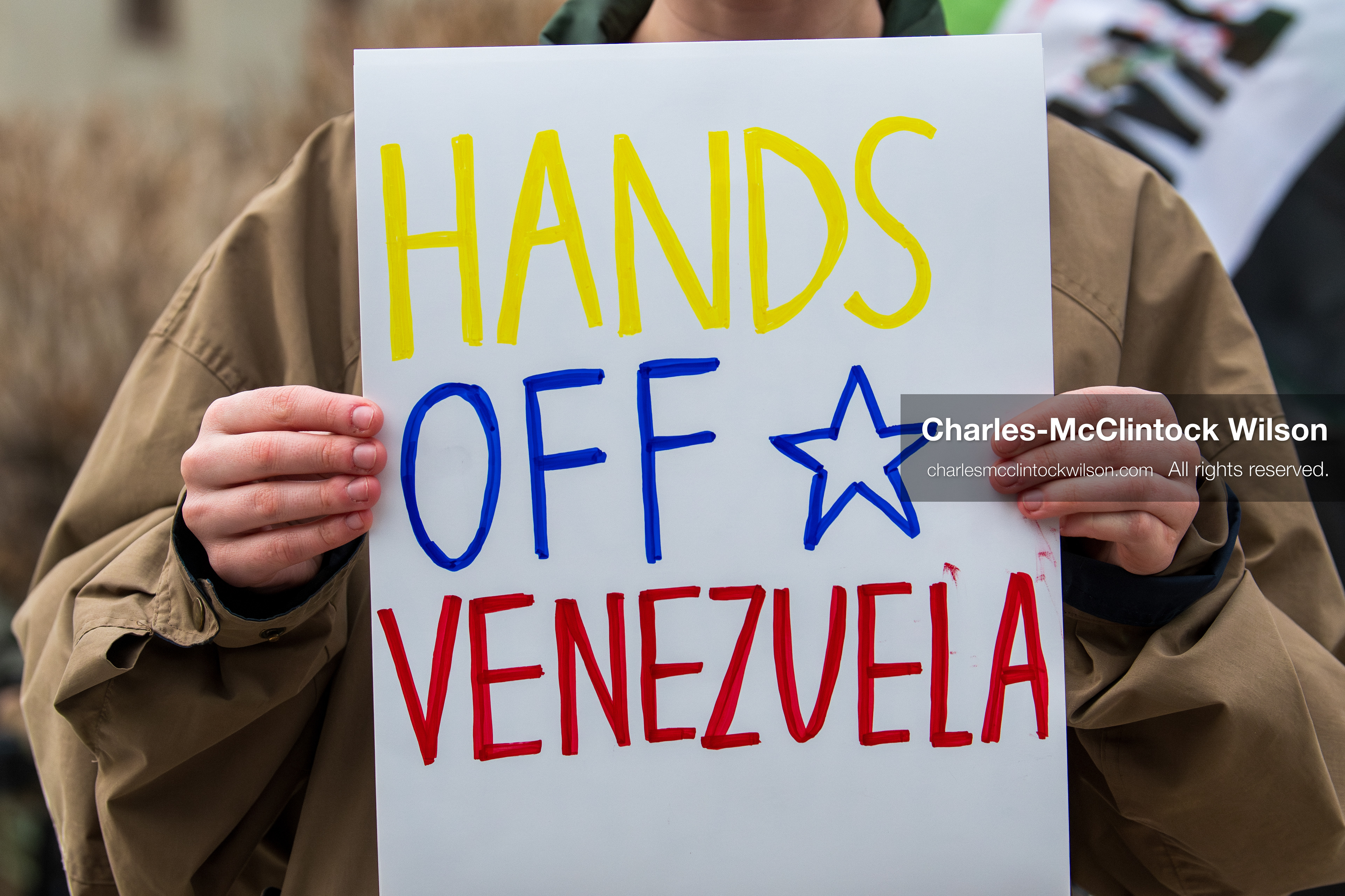 January 3, 2026, Salt Lake City, Utah, USA: A protester holds a sign during a demonstration against US action in Venezuela outside the Wallace Federal Building in Salt Lake City, Utah. The protest was part of a nationwide mobilization responding to recent military developments. (Credit Image: (c) Charles‑McClintock Wilson/ZUMA Press Wire)