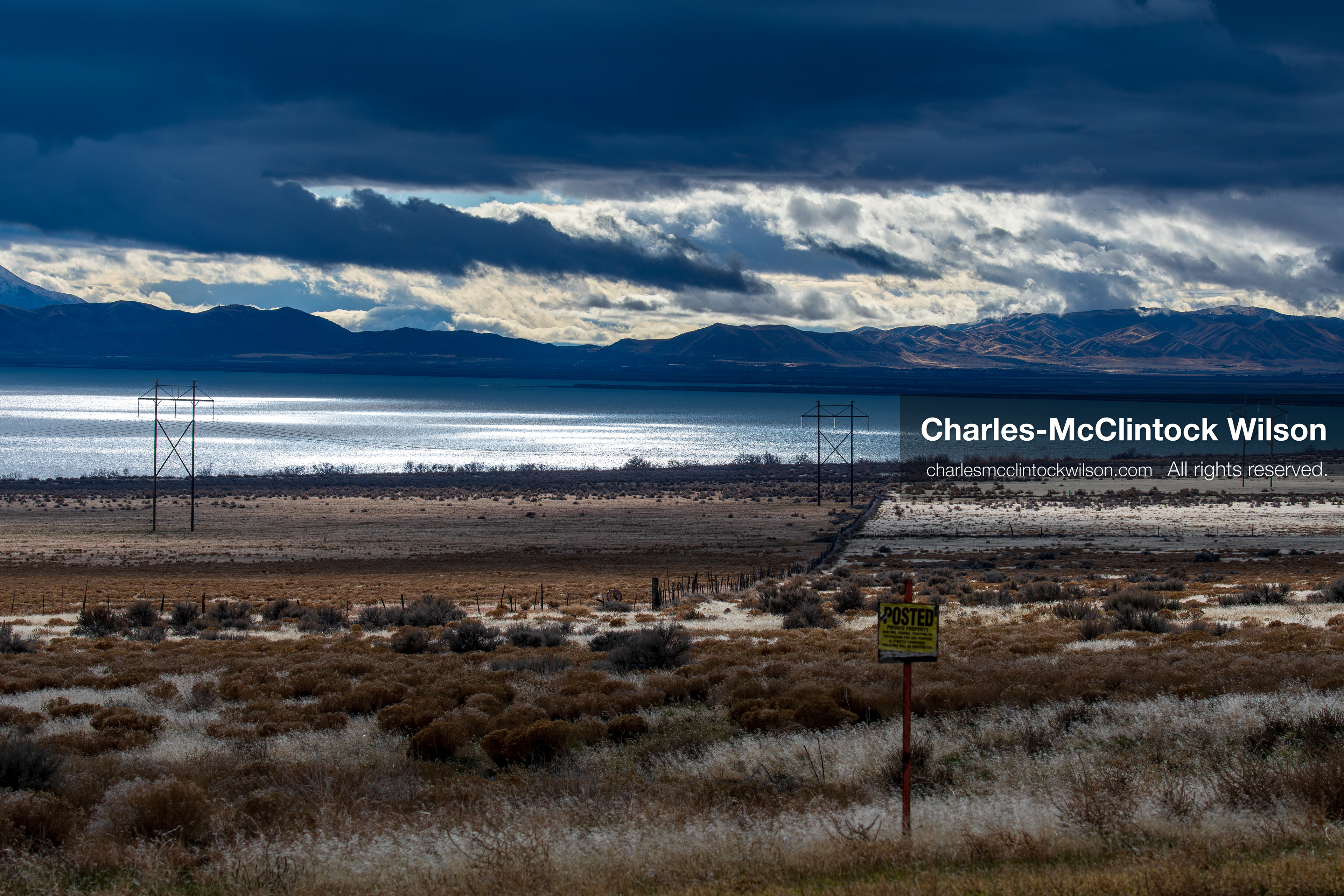 January 1, 2026, Saratoga Springs, Utah, USA: Utah Lake is seen under dramatic cloud cover on January 1, 2026, near Saratoga Springs, Utah, USA. Dry grass, power lines, and a posted sign frame the landscape as winter conditions settle across northern Utah. (Credit Image: © Charles-McClintock Wilson/ZUMA Press Wire)