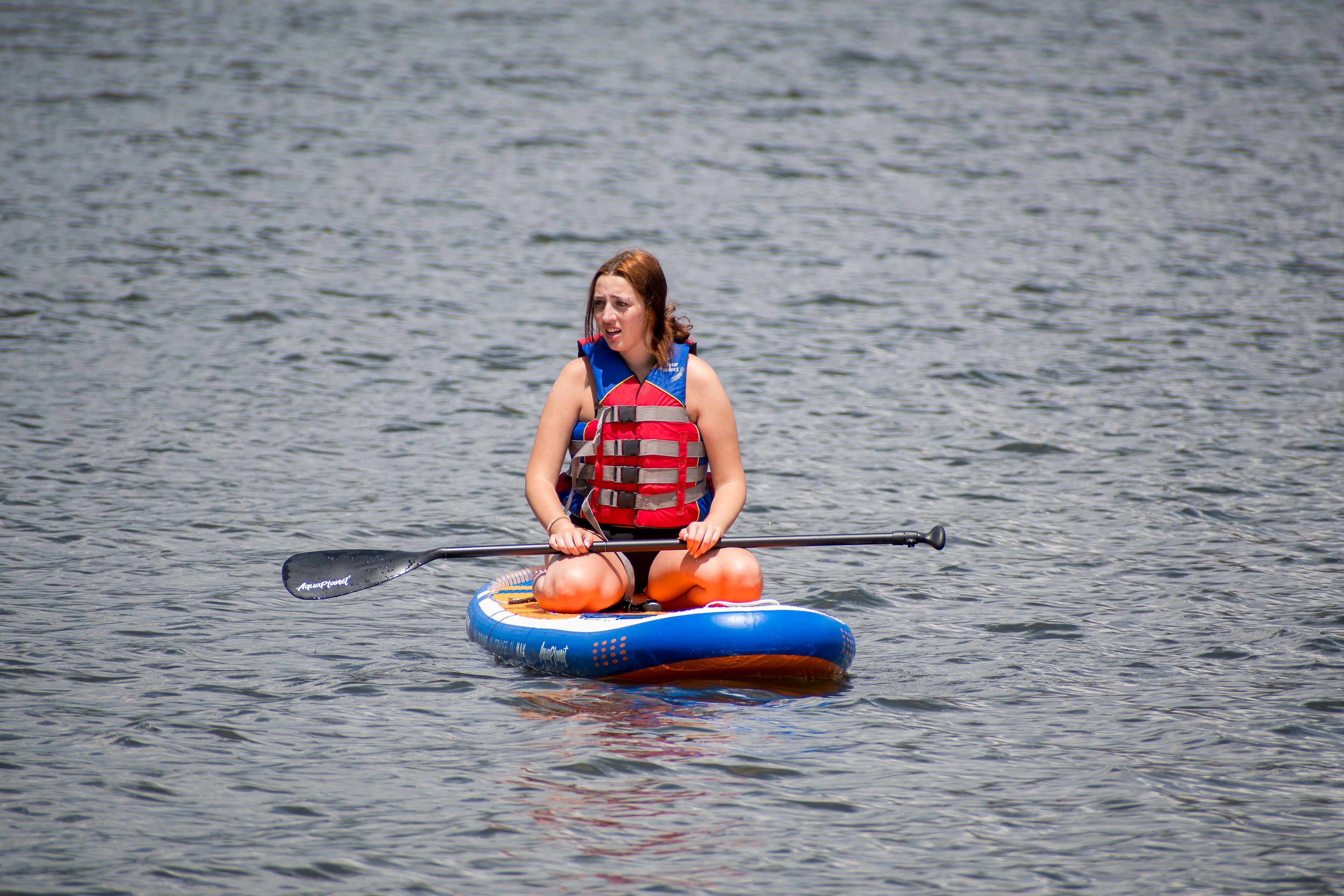 Summit County, Utah – July 20, 2025: A woman paddleboards across the water at Smith and Morehouse Reservoir. 