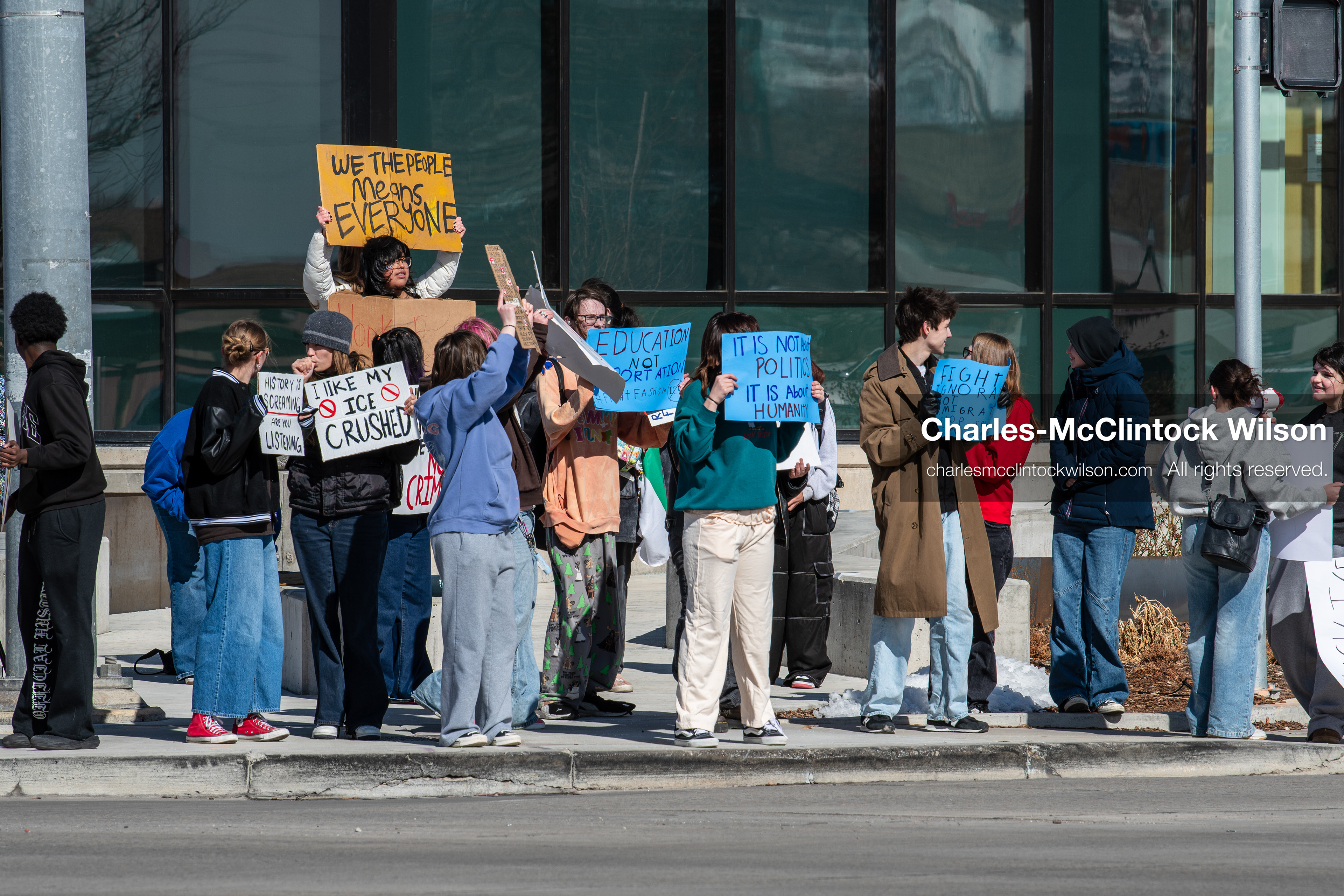 February 20, 2026, Orem, Utah, USA: High school students gather along State Street in front of Orem City Hall during a student led protest against ICE and federal immigration enforcement. Demonstrators hold signs as they stand near the roadway while traffic continues through the area. (Credit Image: © Charles McClintock Wilson/ZUMA Press Wire)