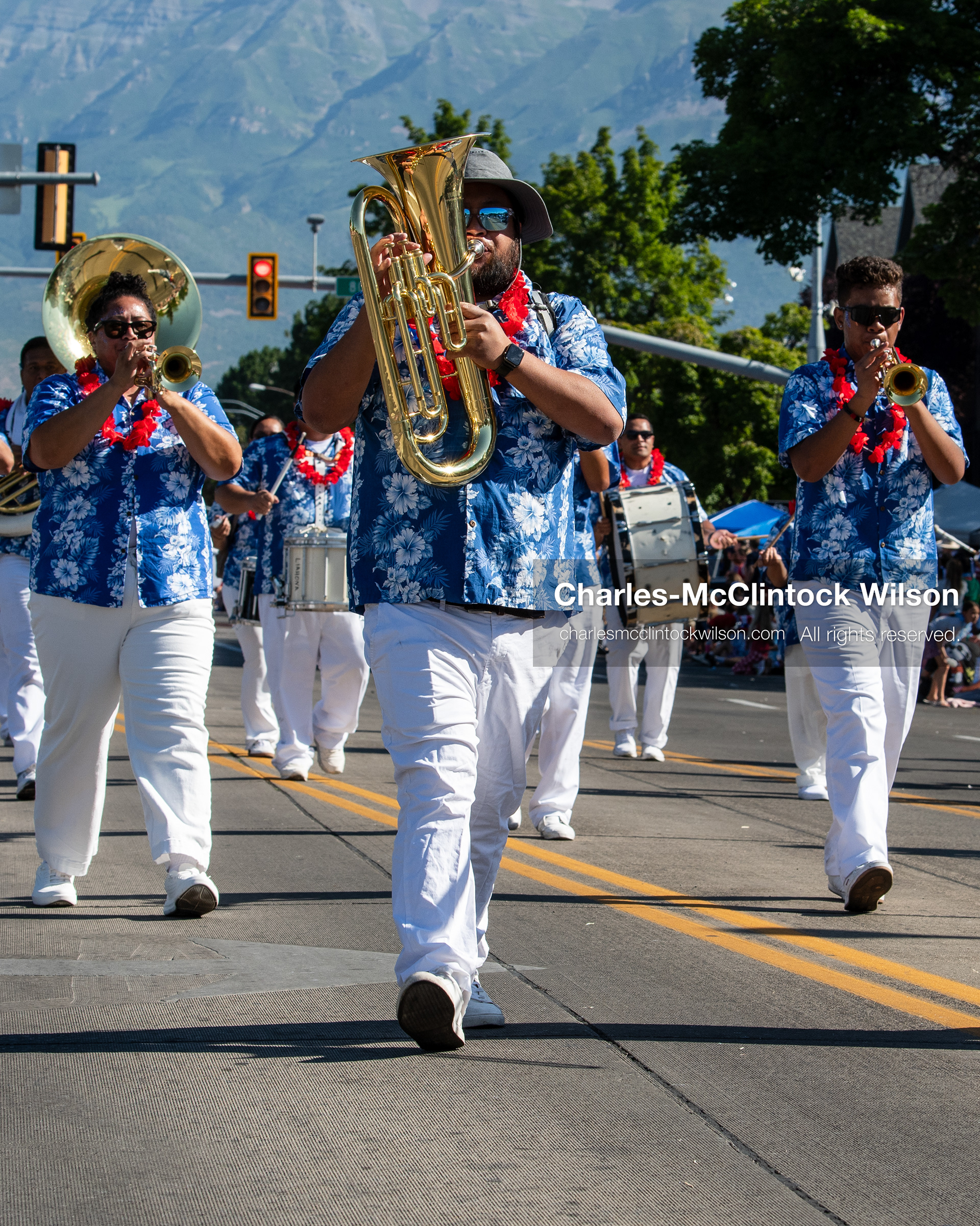 July 4, 2026, Provo, Utah, USA: Members of a marching band wearing matching blue and white floral shirts perform along the route during America's Freedom Festival Grand Parade in Provo, Utah, Saturday, July 4, 2026. The annual event drew thousands of spectators to the downtown corridor. (Credit Image: © Charles-McClintock Wilson/ZUMA Press Wire)