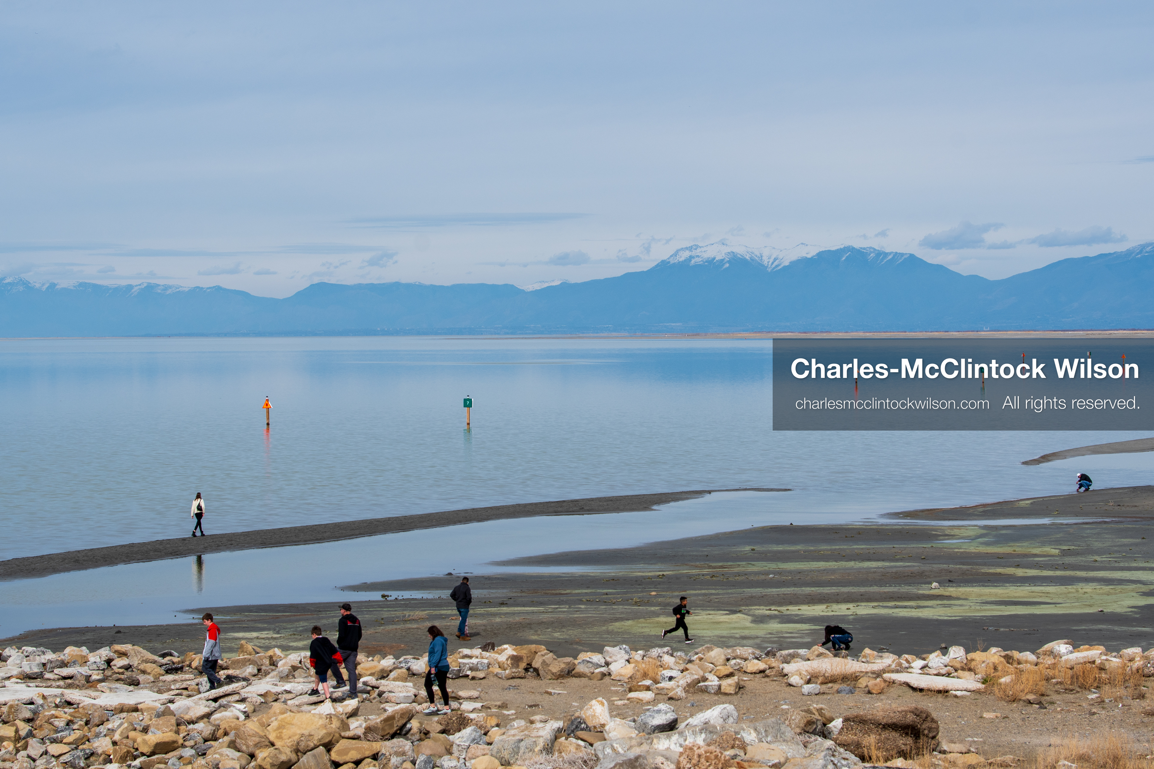 March 1, 2026, Great Salt Lake, Utah, USA: People walk along the shoreline of the Great Salt Lake as water levels remain historically low. Reports from state officials and the Great Salt Lake Strike Team state that the lake continues to fall within a serious adverse‑effects range, with elevations among the lowest recorded in more than one hundred years. The lake has drawn increased public attention as lawmakers consider large‑scale water projects and long‑term plans to address declining conditions. (Credit Image: © Charles‑McClintock Wilson/ZUMA Press Wire)