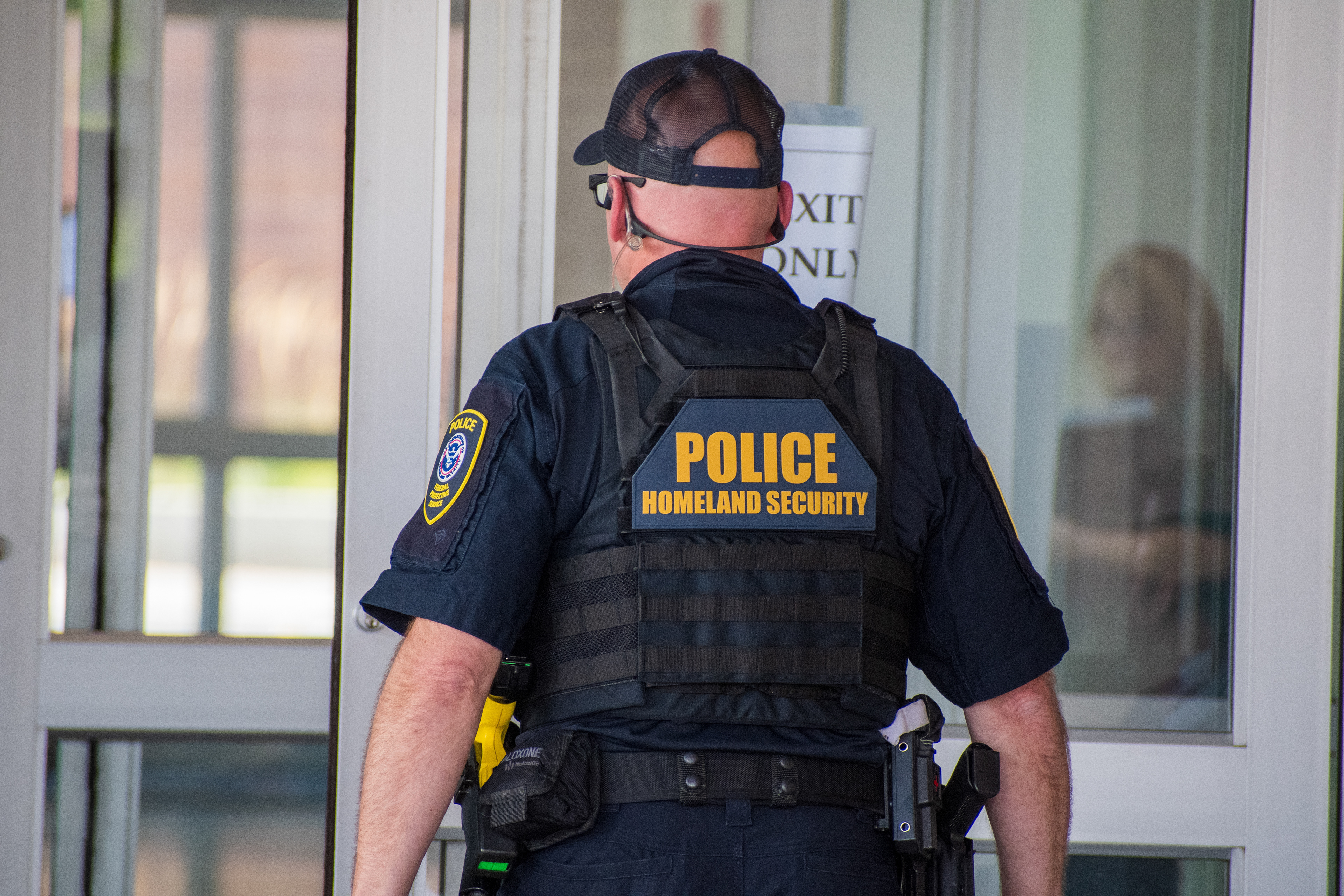September 15, 2025 – Provo, Utah, United States: A Homeland Security police officer stands near a glass door marked “EXIT ONLY” at the Utah Valley Convention Center during a Department of Homeland Security career expo focused on recruiting law enforcement and security personnel. Photograph by Charles‑McClintock Wilson / ZUMA Press Wire