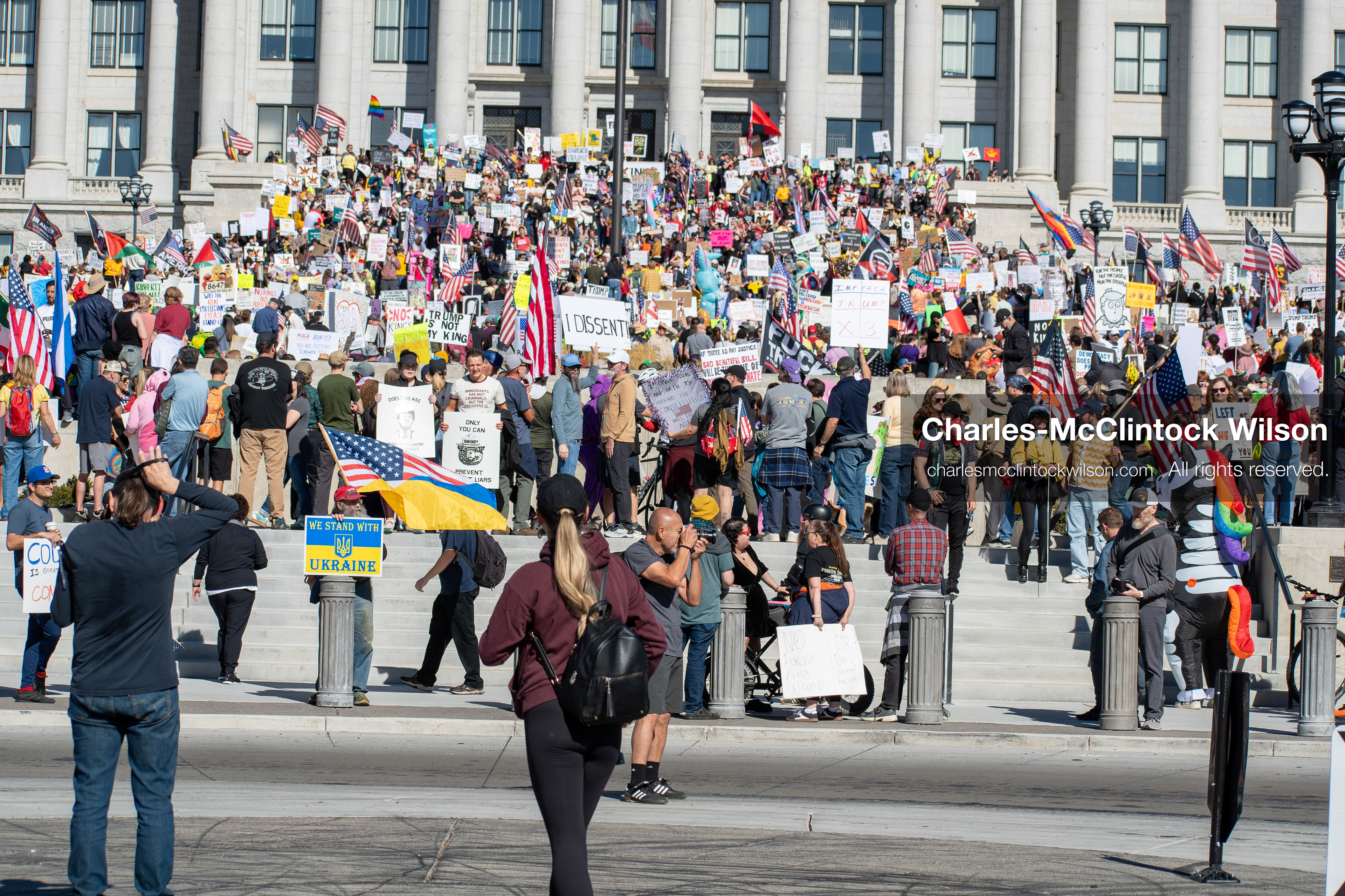 October 18, 2025, Salt Lake City, Utah, USA: Demonstrators participate in a "No Kings" protest held at the Utah State Capitol. Participants hold signs and flags during the public gathering.