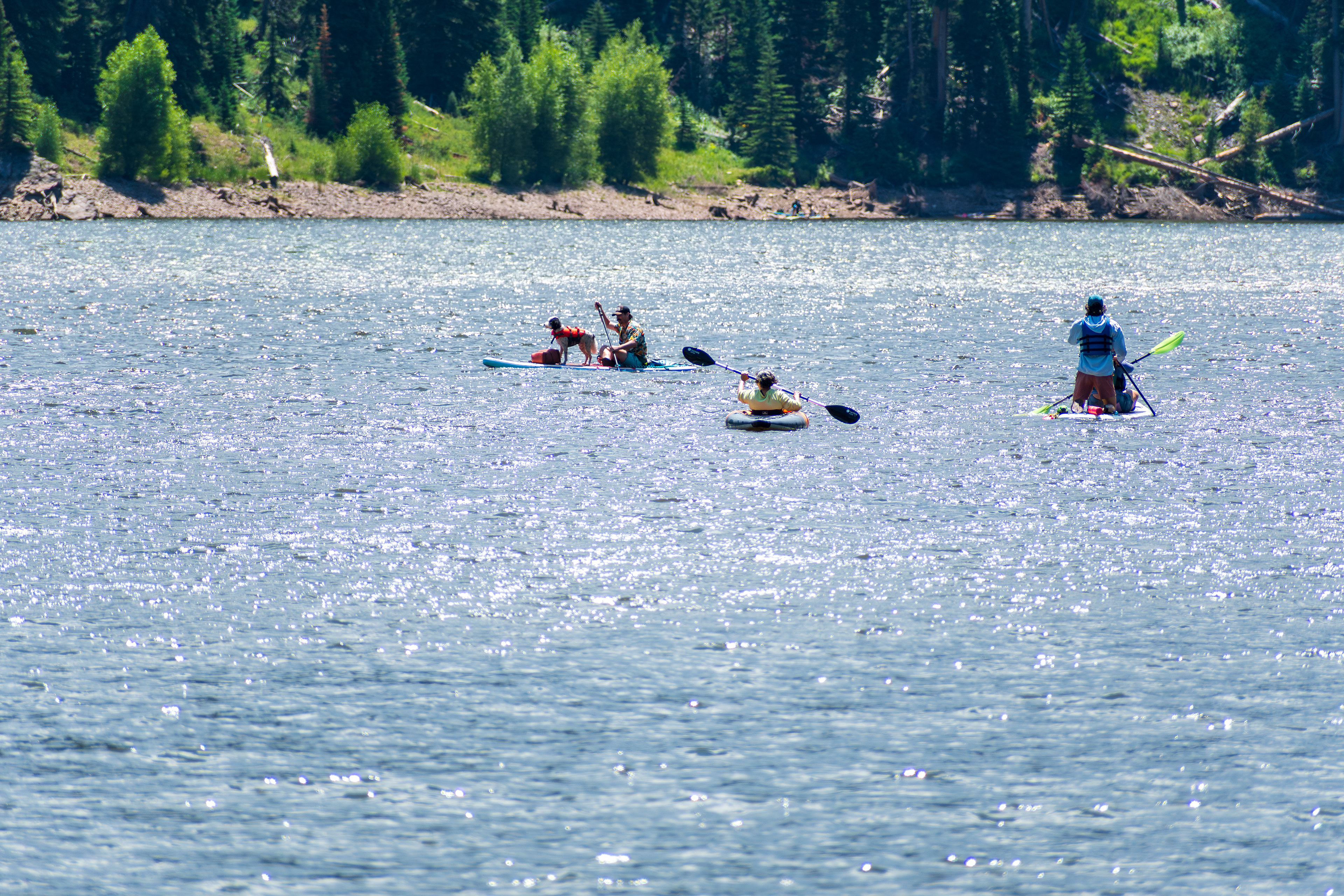 Summit County, Utah – July 20, 2025: People enjoy outdoor recreation on kayaks and paddleboards at Smith and Morehouse Reservoir.