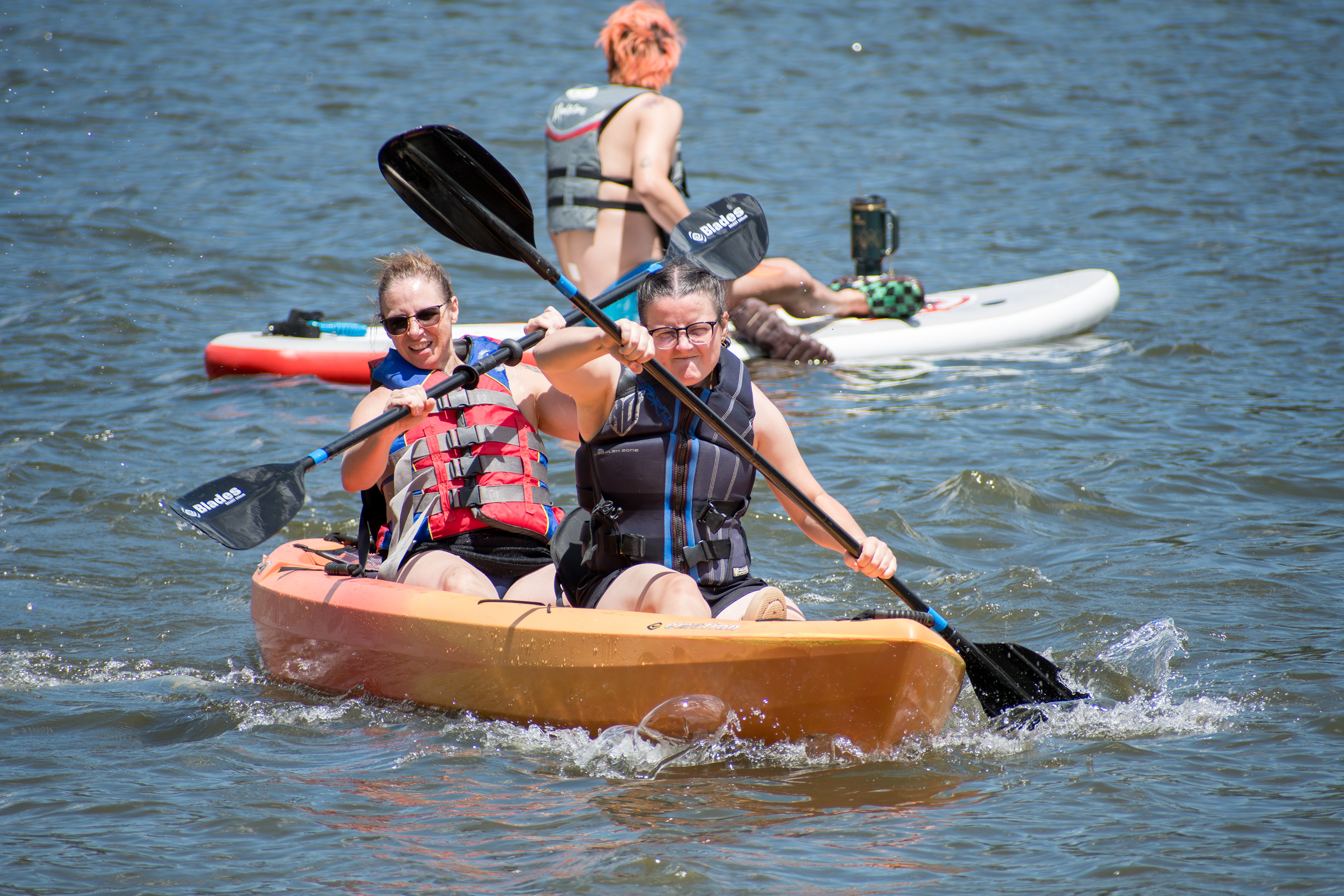 Summit County, Utah – July 20, 2025: People enjoy outdoor recreation on kayaks and paddleboards at Smith and Morehouse Reservoir.