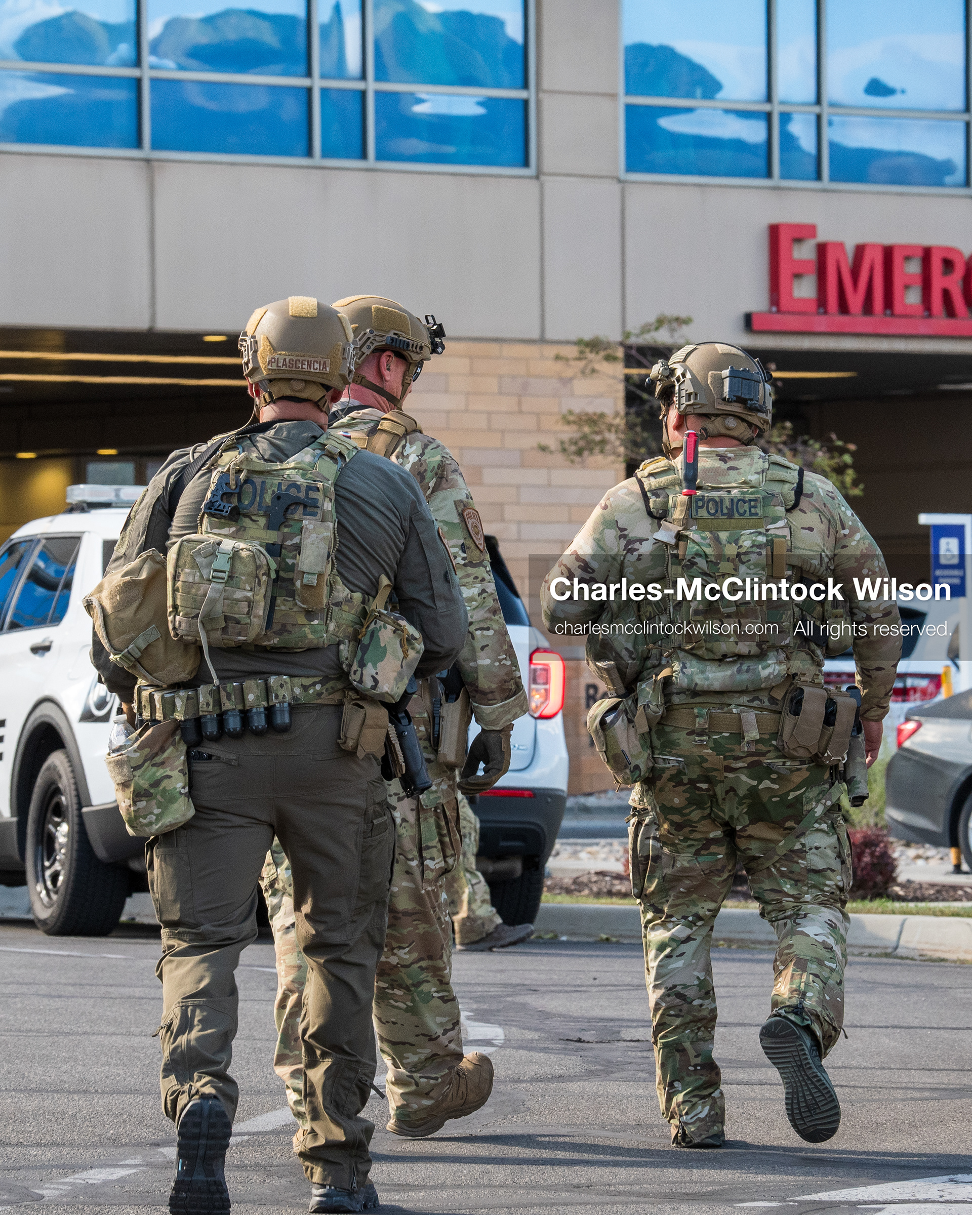 August 17, 2026, Murray, Utah, USA: Armed law enforcement officers in tactical gear patrol the parking lot outside the emergency department entrance at Intermountain Medical Center on Monday. Multiple police agencies secured the hospital perimeter as a safety precaution after shooting victims were brought in from a fatal shootout outside a funeral in nearby Kearns. (Credit Image: © Charles McClintock Wilson/ZUMA Press Wire)
