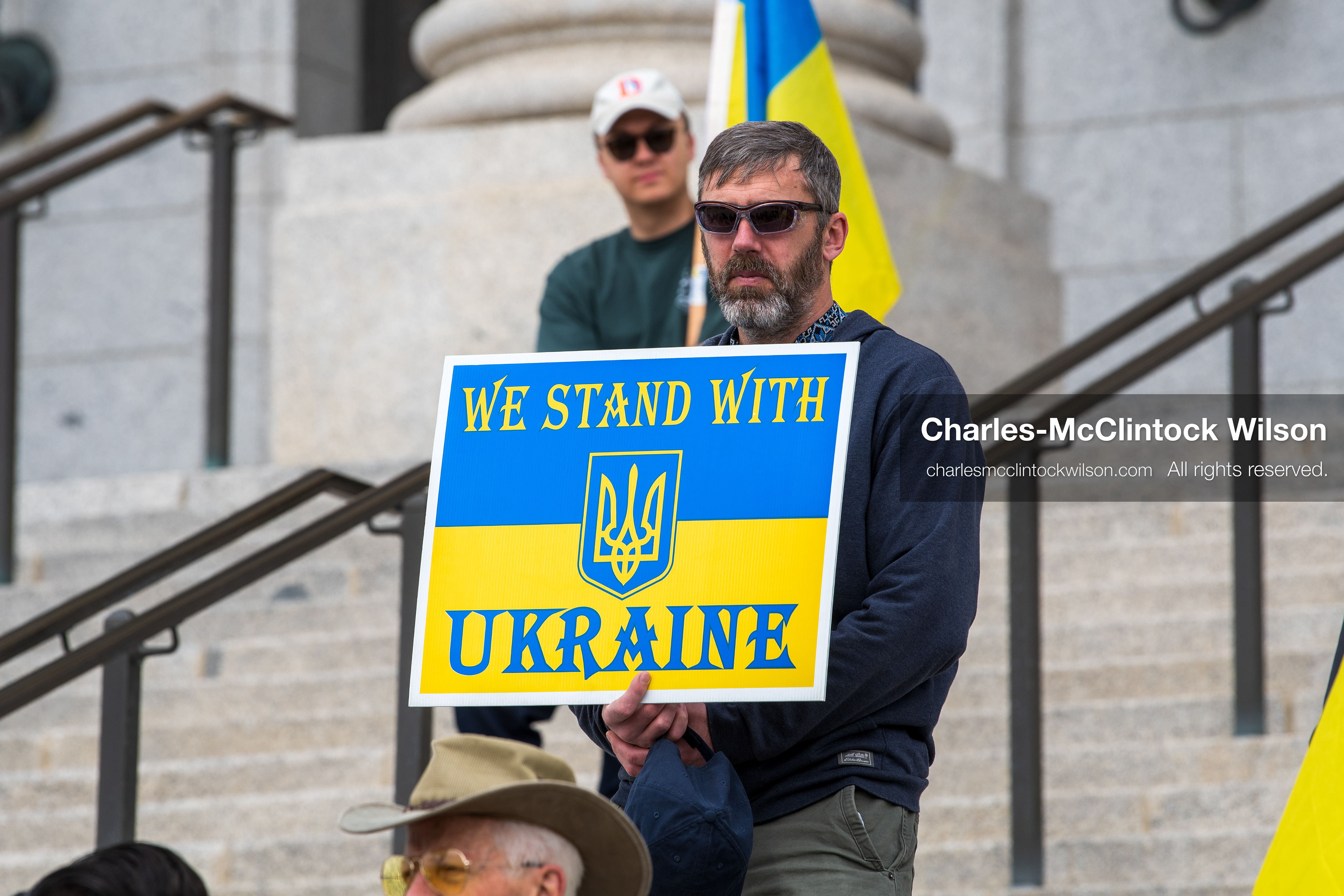 February 28, 2026, Salt Lake City, Utah, USA: A demonstrator holds a sign reading We Stand With Ukraine in the colors of the Ukrainian flag during the Stand With Ukraine rally at the Utah State Capitol. The gathering marked the four year anniversary of the full scale Russian invasion of Ukraine and brought community members together in support of Ukrainians and local humanitarian efforts. (Credit Image: © Charles McClintock Wilson/ZUMA Press Wire)