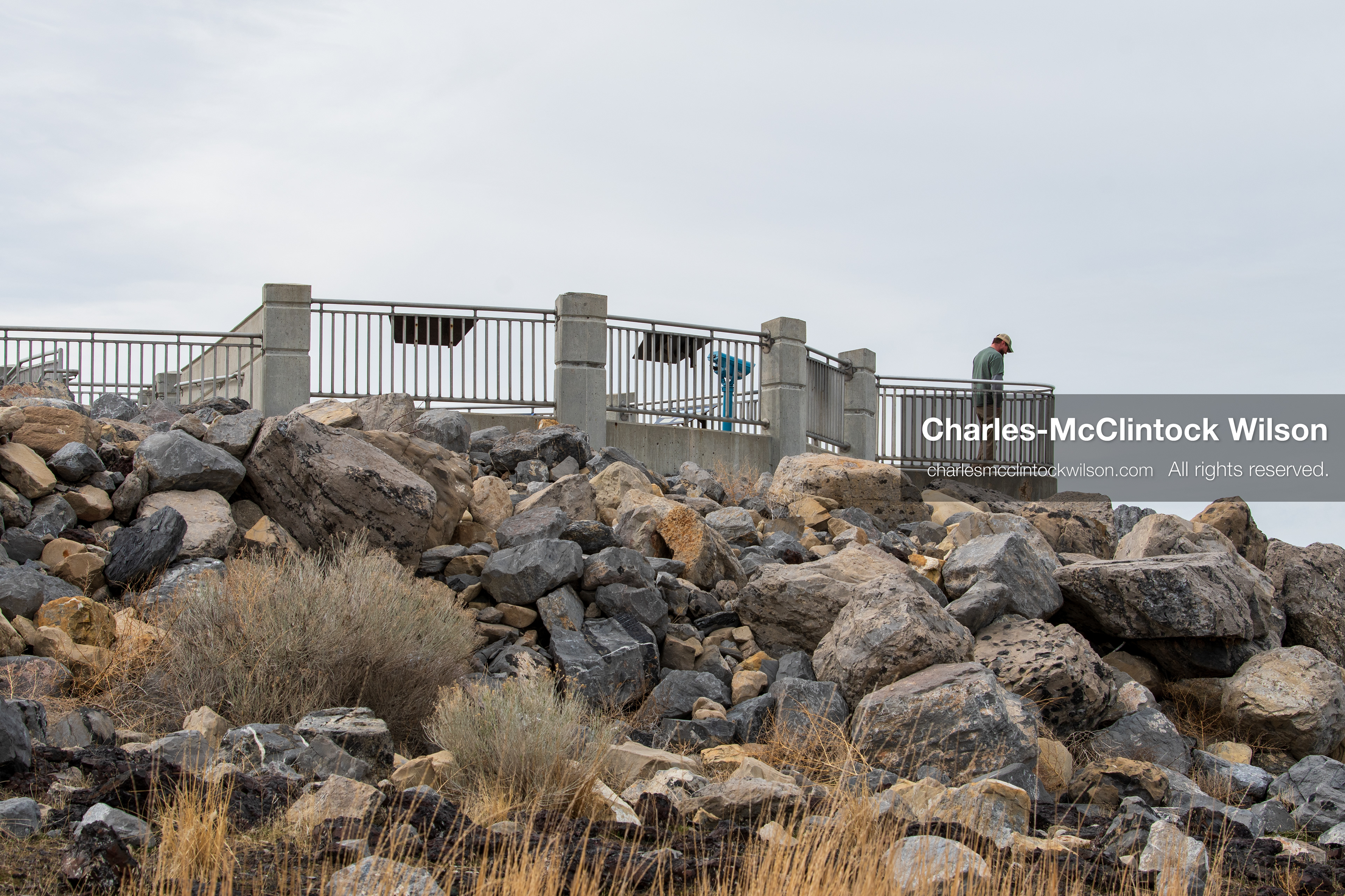 March 1, 2026, Great Salt Lake, Utah, USA: A man stands on an observation platform overlooking the Great Salt Lake as the region continues to experience historically low water levels. Reports from state officials and the Great Salt Lake Strike Team state that the lake remains in a serious adverse‑effects range, with elevations among the lowest recorded in more than one hundred years. The lake has drawn increased public attention as lawmakers consider large‑scale water projects and long‑term plans to address declining conditions. (Credit Image: © Charles‑McClintock Wilson/ZUMA Press Wire)