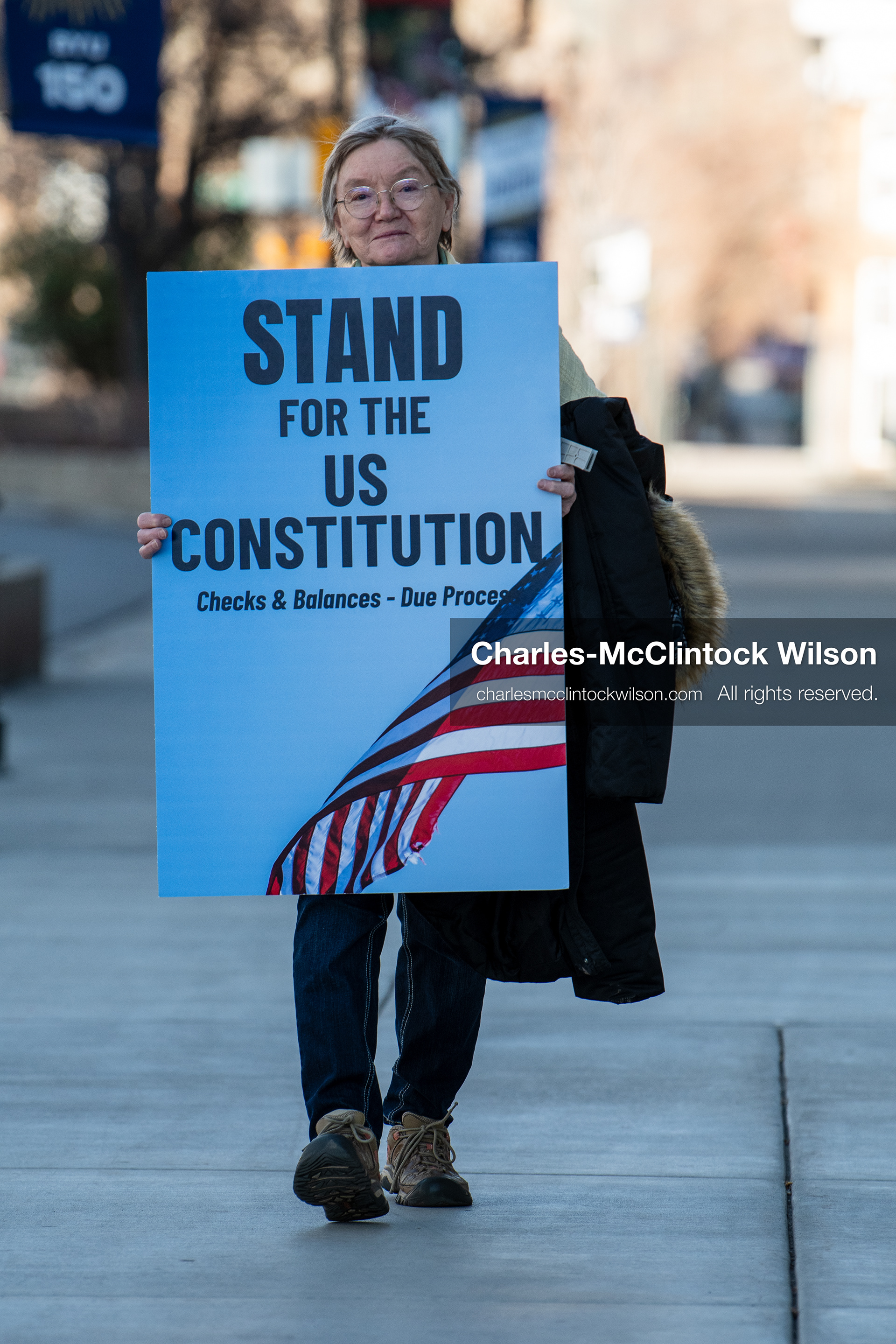 January 20, 2026, Provo, Utah, USA: A demonstrator stands outside Provo City Hall during the Free America Walkout protest in Provo Utah on January 20 2026. The nationwide event called for immigration reform and changes to detention practices. 
