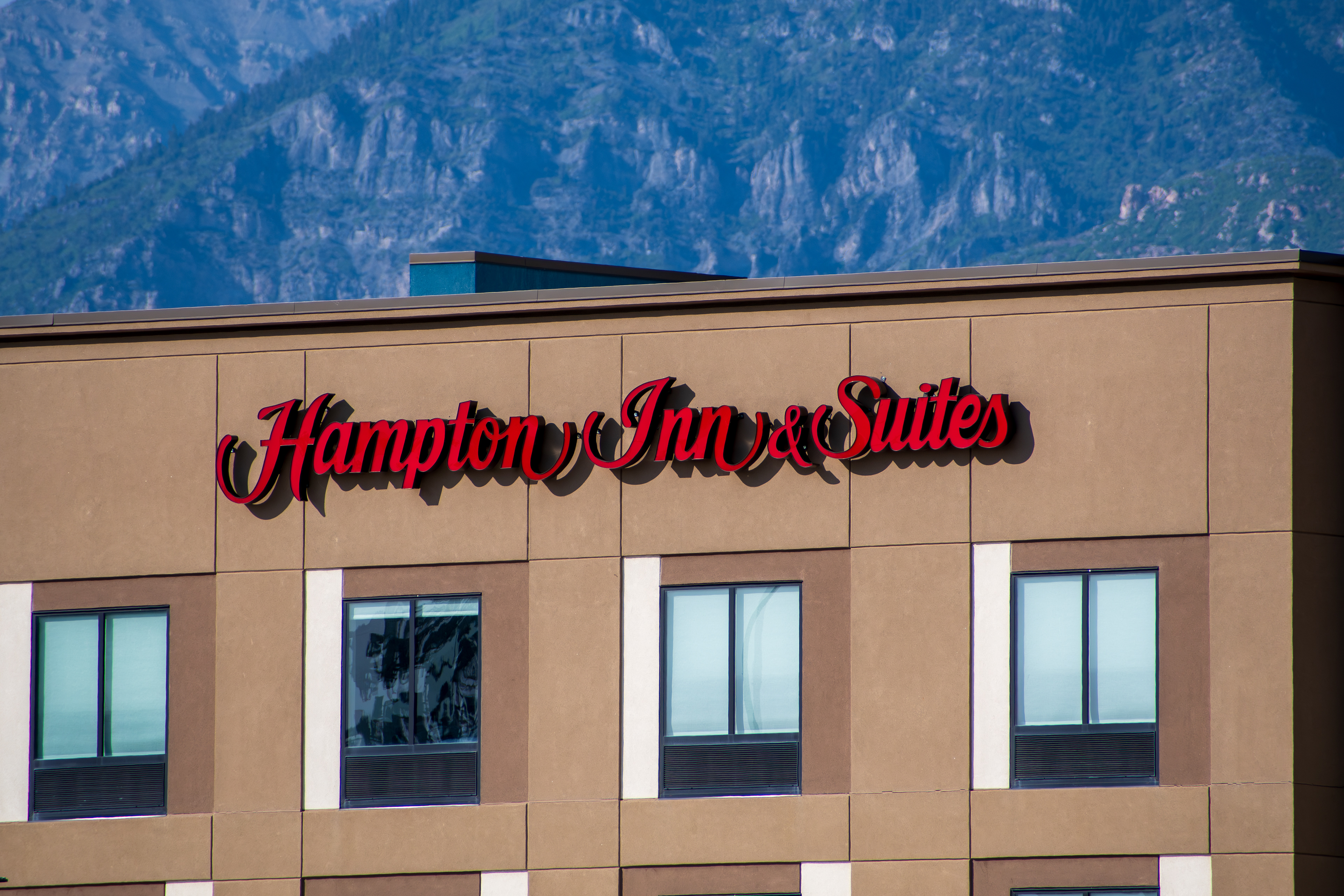 SPANISH FORK, UTAH, USA - JUNE 8, 2025: Exterior view of a Hampton Inn Hotel. Hampton Inn is an American chain of hotels trademarked by Hilton Worldwide.