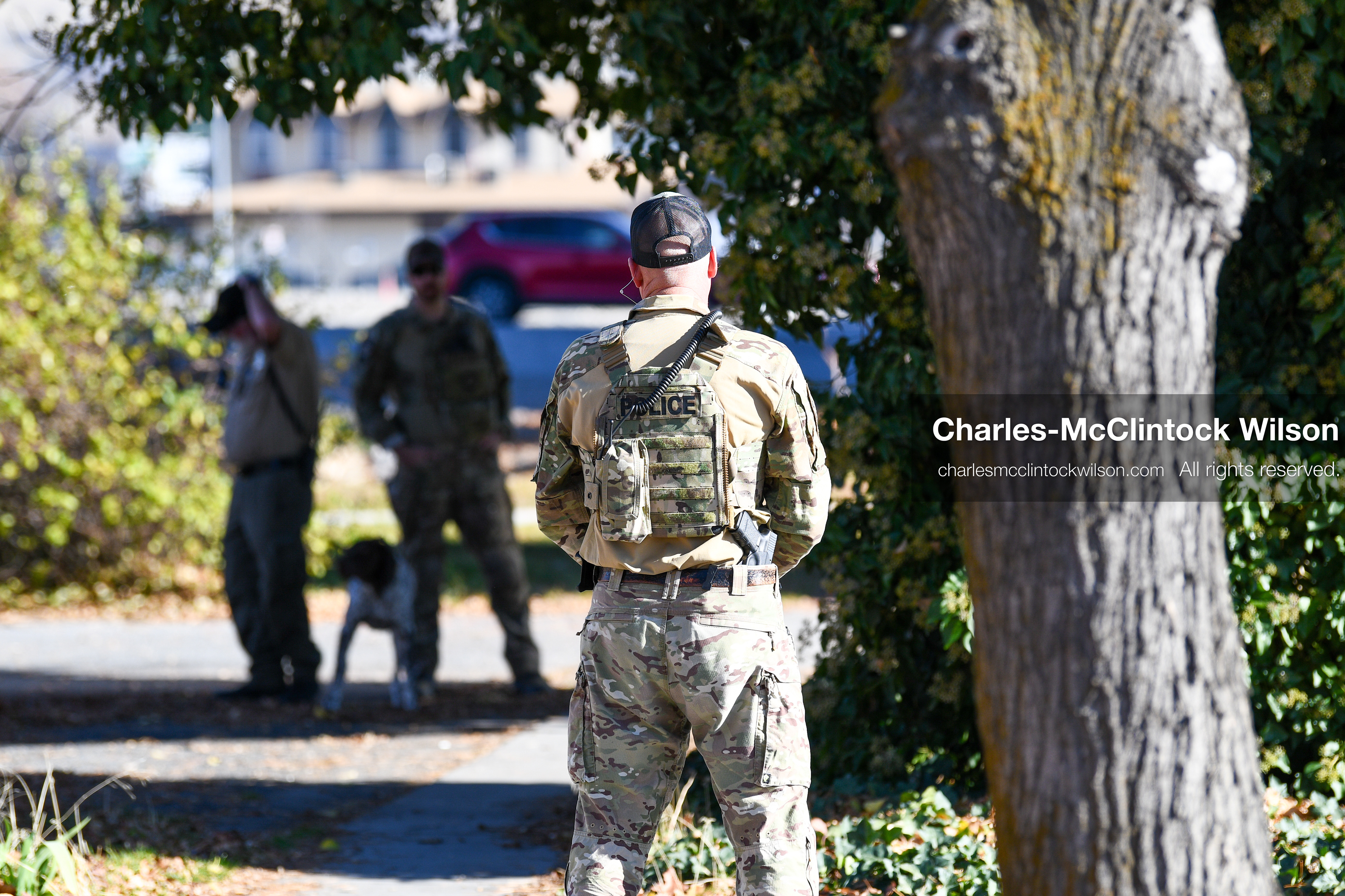 PROVO, UTAH, USA – DECEMBER 11, 2025: Police officers investigate a suspicious package with a K‑9 unit near the Fourth District Court in Provo during the first in‑person court appearance of Tyler Robinson in the Charlie Kirk murder case. (Credit Image: © Charles‑McClintock Wilson/ZUMA Press Wire)