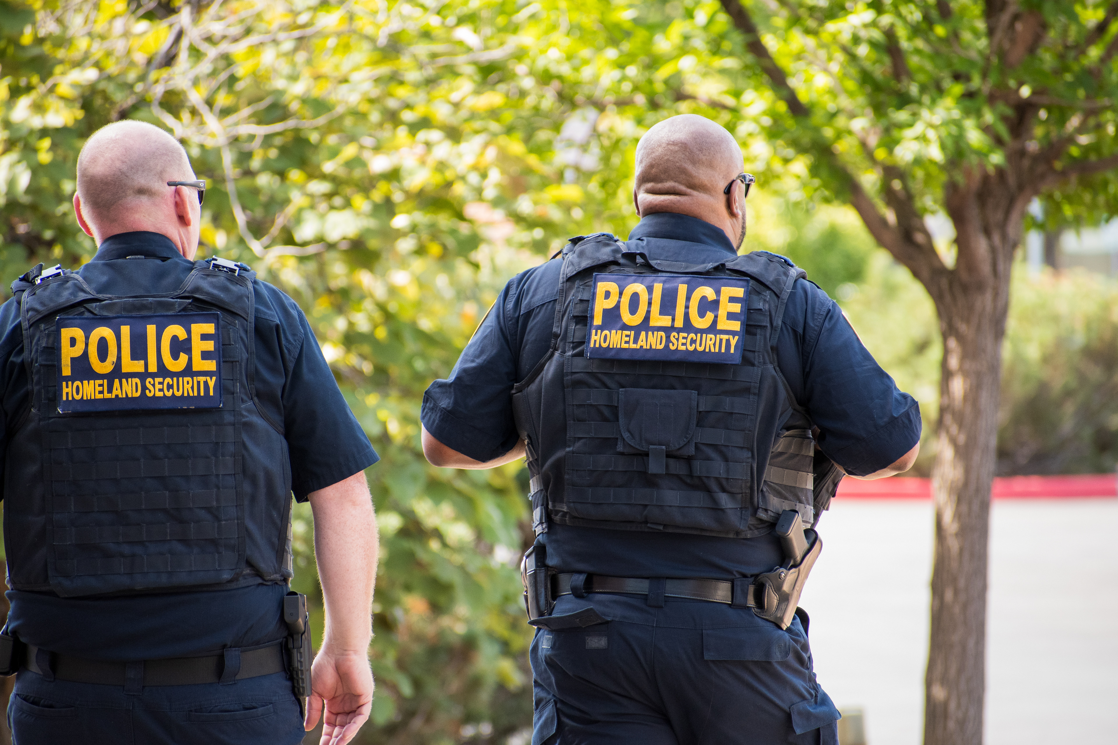 September 15, 2025 – Provo, Utah, United States: Two Homeland Security police officers walk through a parking lot near the Utah Valley Convention Center during a Department of Homeland Security career expo focused on recruiting law enforcement and security personnel. Photograph by Charles‑McClintock Wilson / ZUMA Press Wire