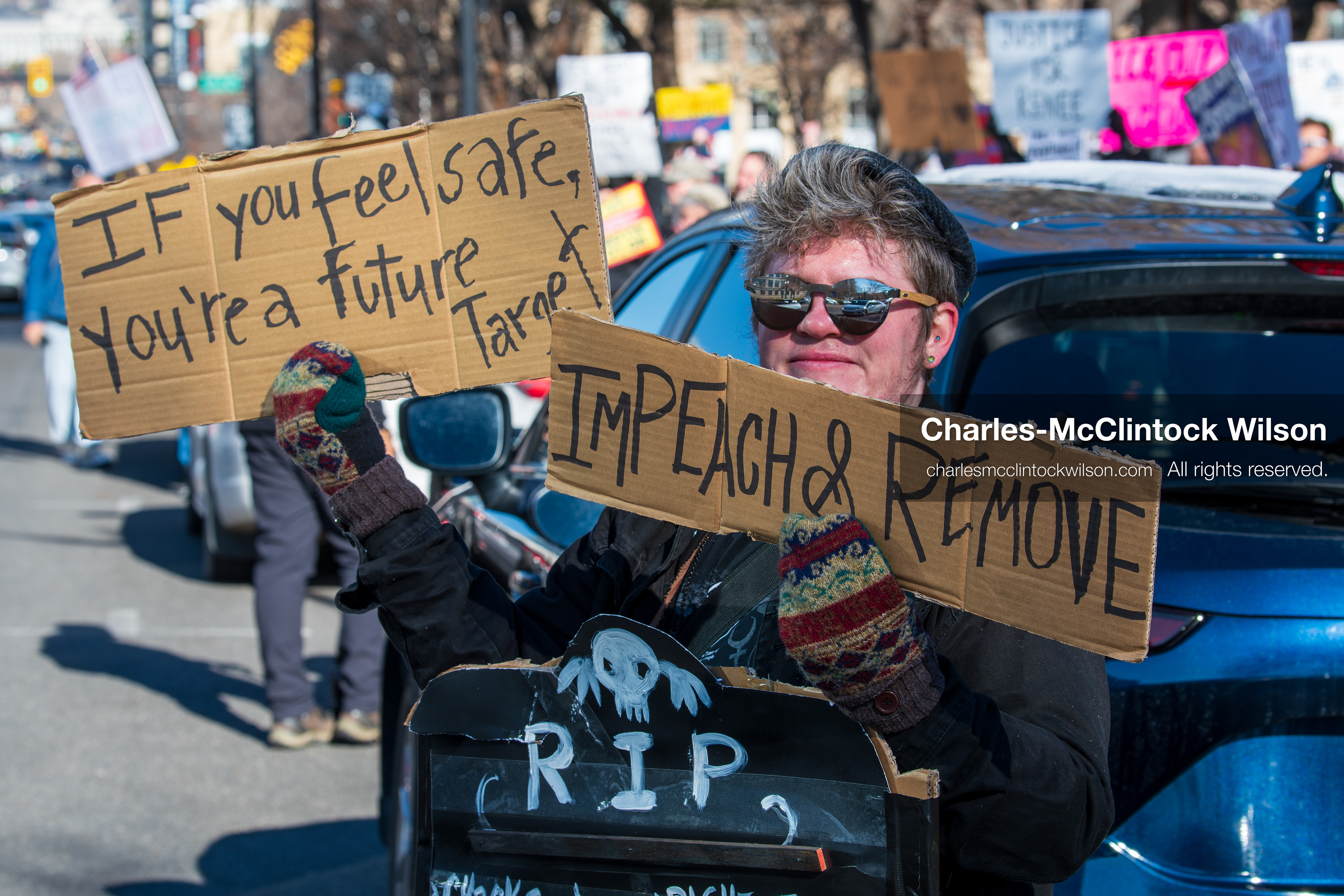 Salt Lake City, Utah, January 10, 2026: A protester holds two signs during the ICE Out for Good protest, a demonstration against ICE and calling for justice for Renee Nicole Good. (Credit Image: © Charles‑McClintock Wilson/ZUMA Press Wire)