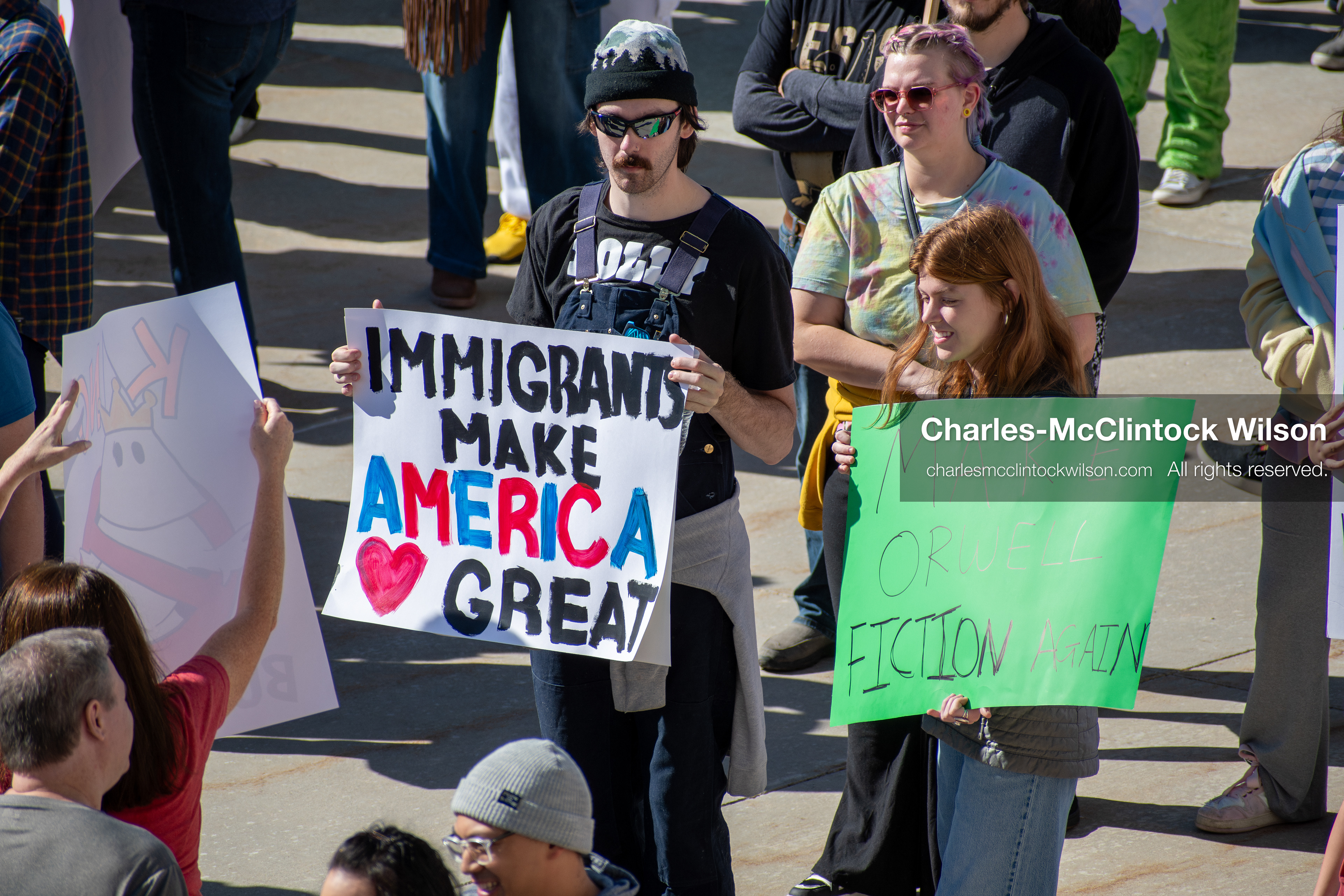 October 18, 2025, Salt Lake City, Utah, USA: Demonstrators hold signs during a "No Kings" protest at the Utah State Capitol. The protest was part of a nationwide mobilization. 