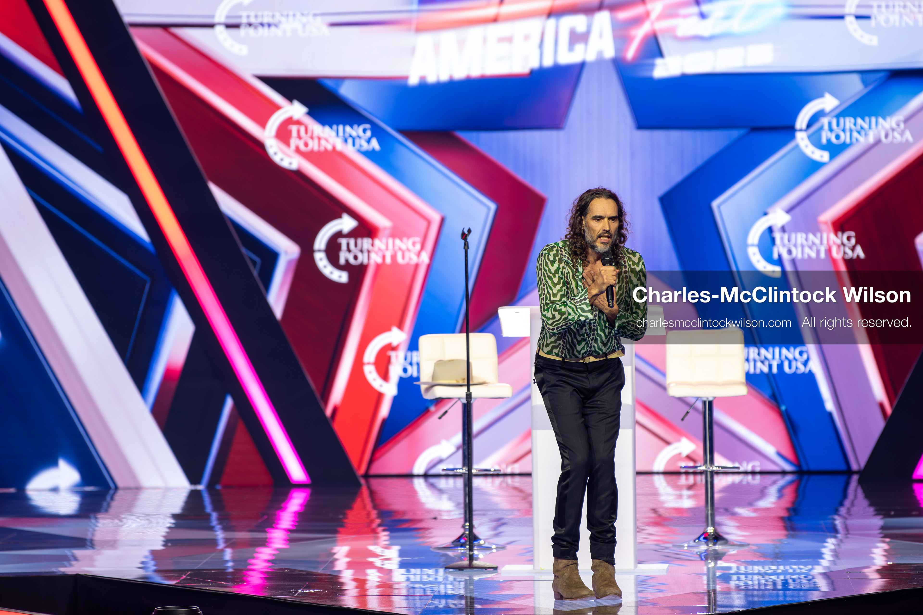 December 18, 2025, Phoenix, Arizona, USA: Russell Brand speaks during Day One of Turning Point USA’s AmericaFest 2025 at the Phoenix Convention Center in Phoenix, Arizona.   (Credit Image: © Charles‑McClintock Wilson/ZUMA Press Wire)