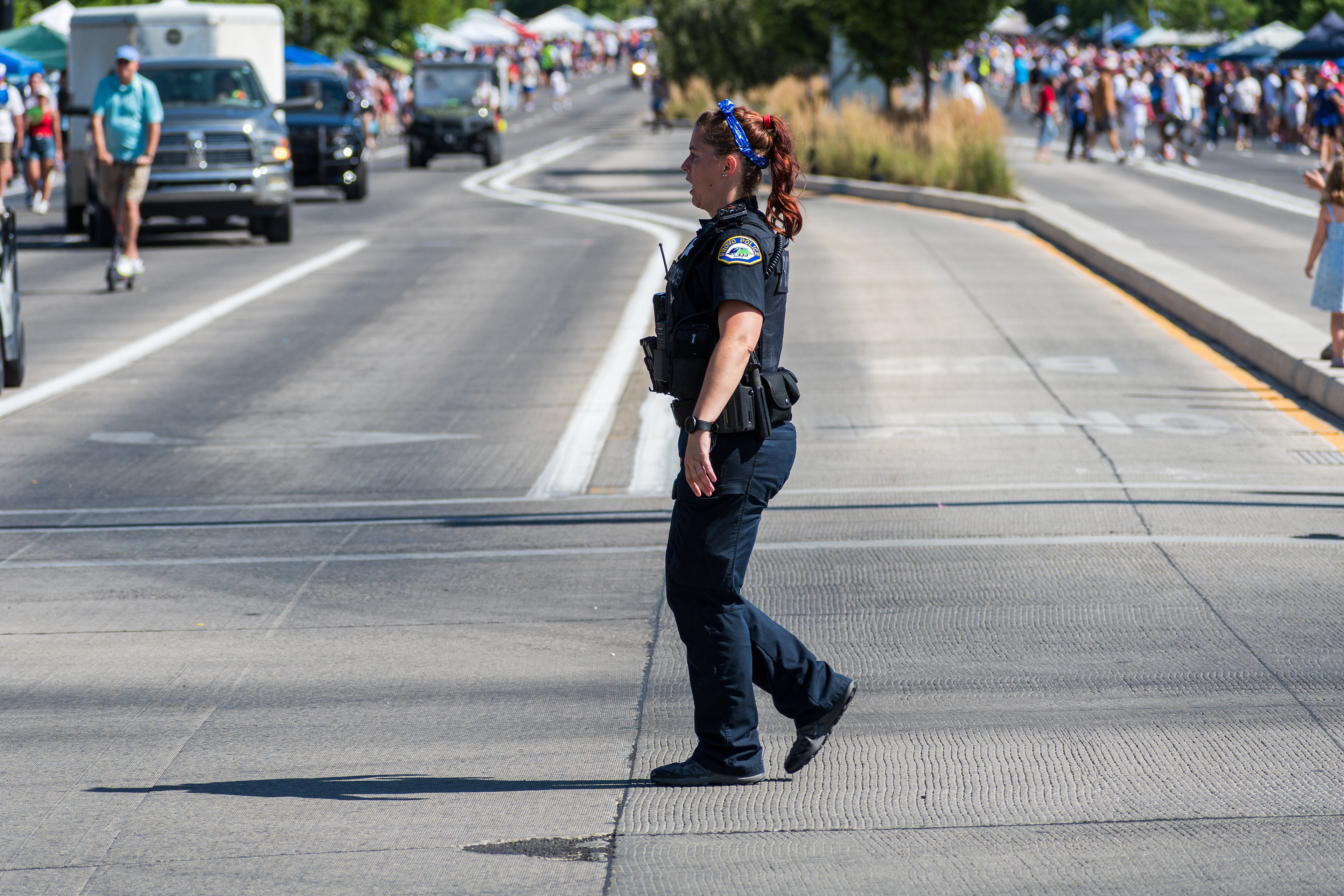 Provo, Utah – July 4, 2025: A female law enforcement officer walks along the parade route during the Freedom Festival Grand Parade in downtown Provo.