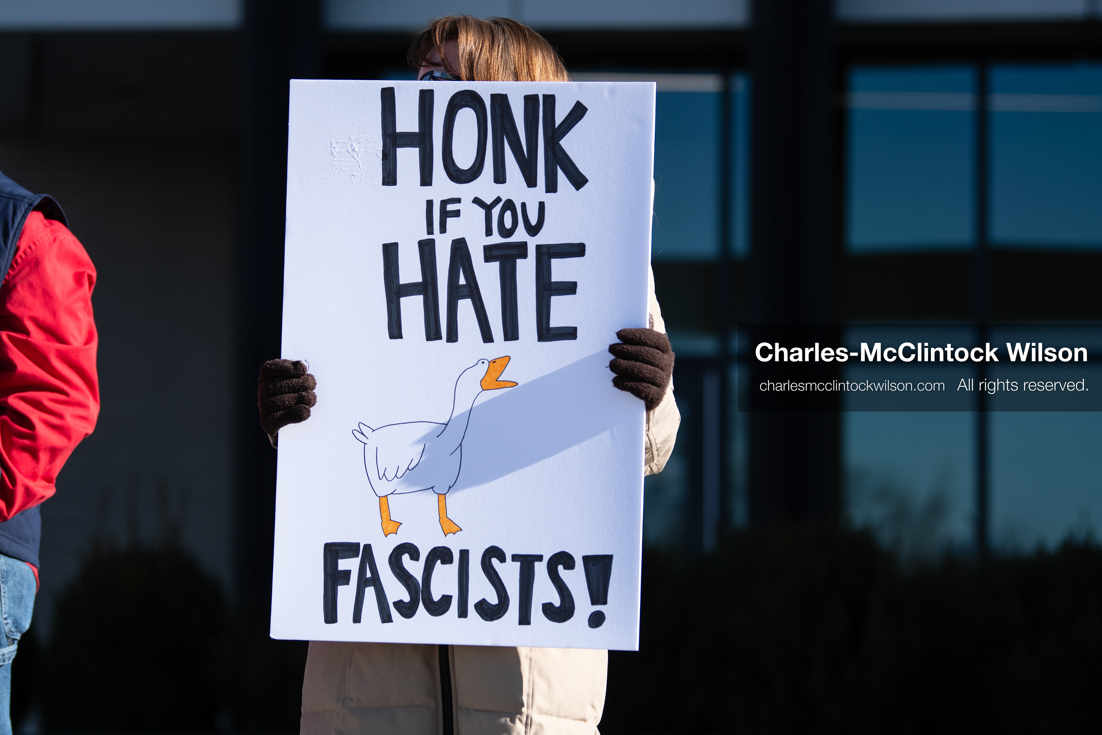  January 20, 2026, Provo, Utah, USA: A demonstrator stands outside Provo City Hall during the Free America Walkout protest in Provo Utah on January 20 2026. The nationwide event called for immigration reform and changes to detention practices.