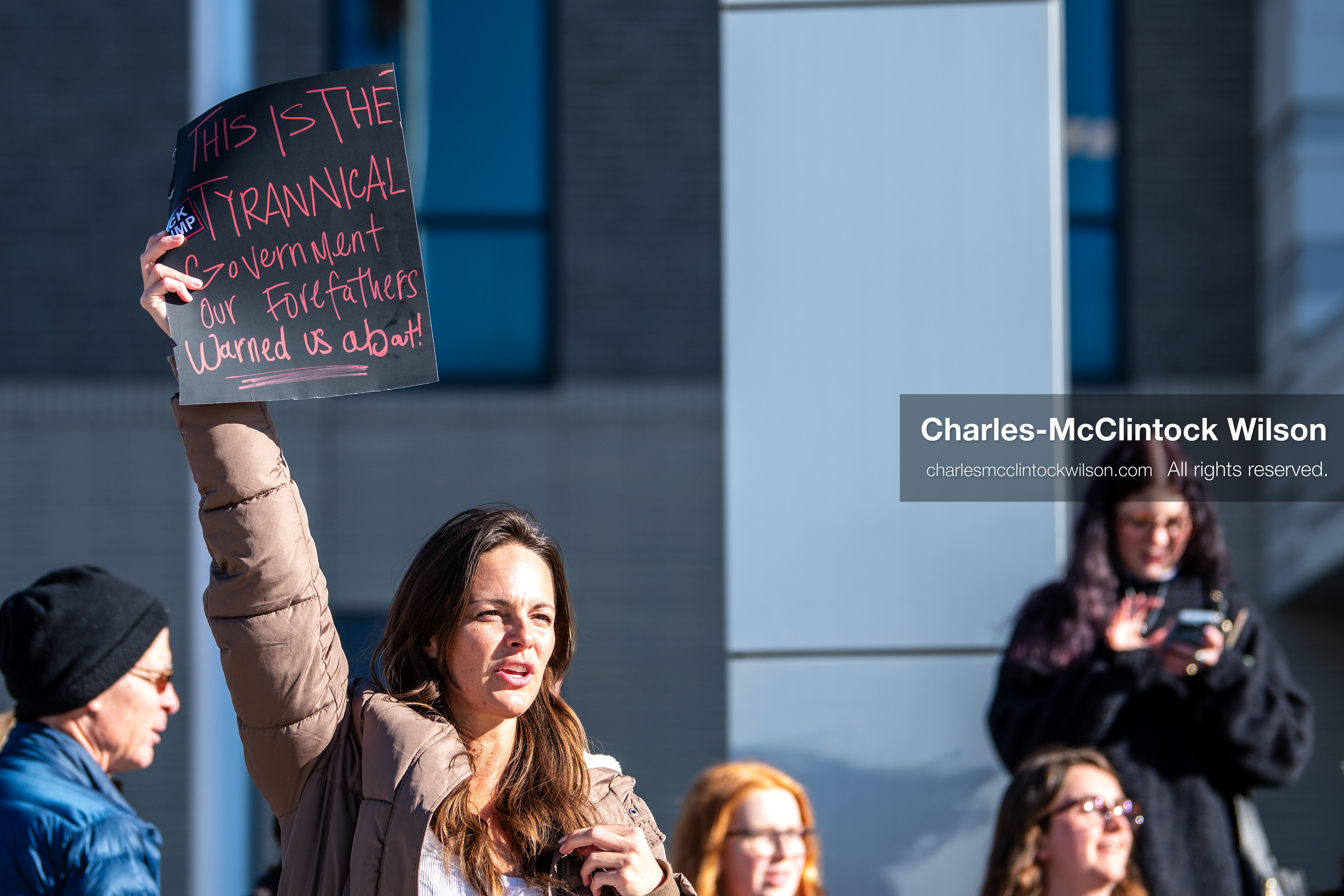 January 20, 2026, Provo, Utah, USA: A demonstrator stands outside Provo City Hall during the Free America Walkout protest in Provo Utah on January 20 2026. The nationwide event called for immigration reform and changes to detention practices. 