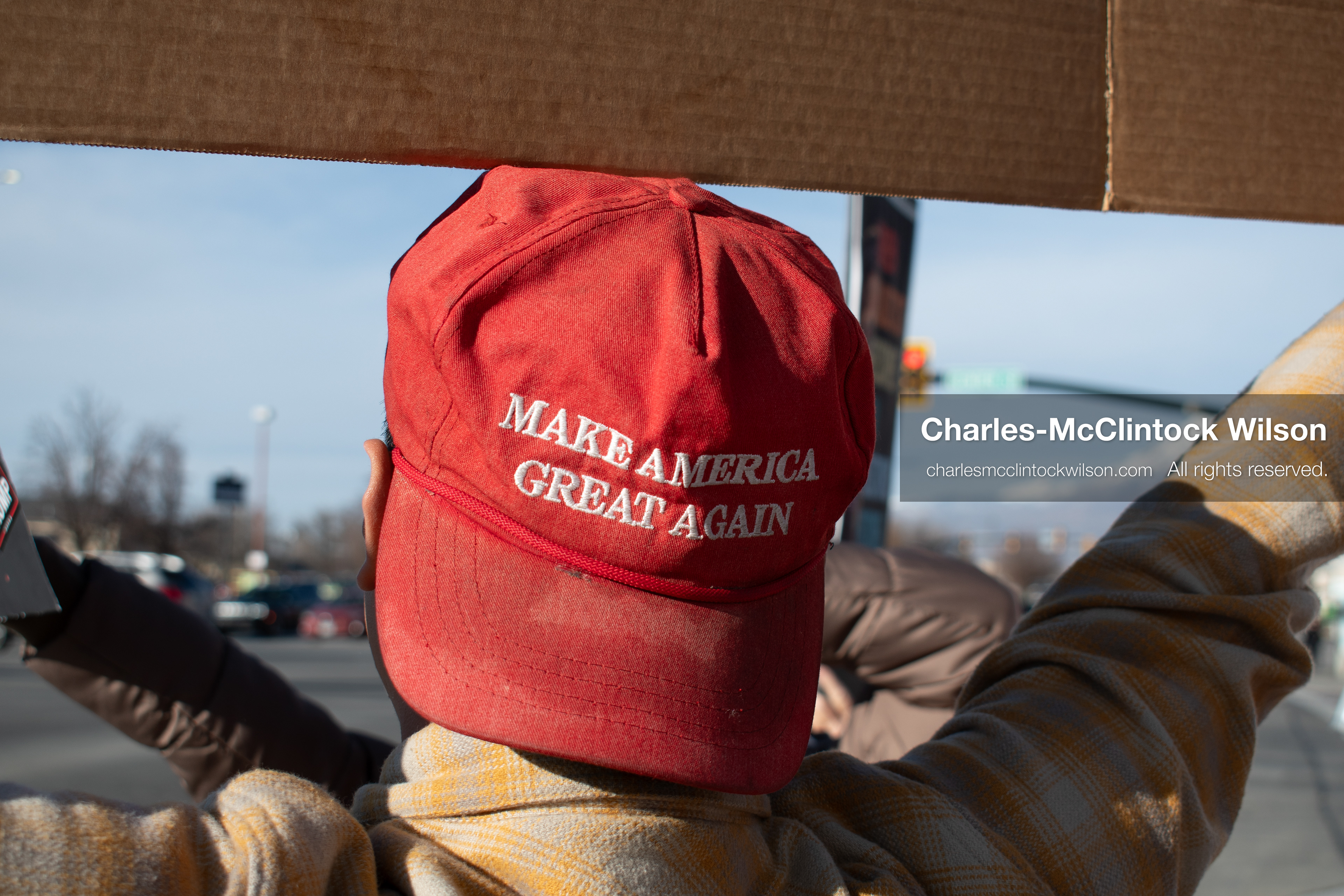 January 20, 2026, Provo, Utah, USA: A person wearing a Make America Great Again hat raises an arm during the Free America Walkout outside Provo City Hall in Provo Utah on January 20 2026. The nationwide protest drew demonstrators with varied political views. (Credit Image: © Charles-McClintock Wilson/ZUMA Press Wire)