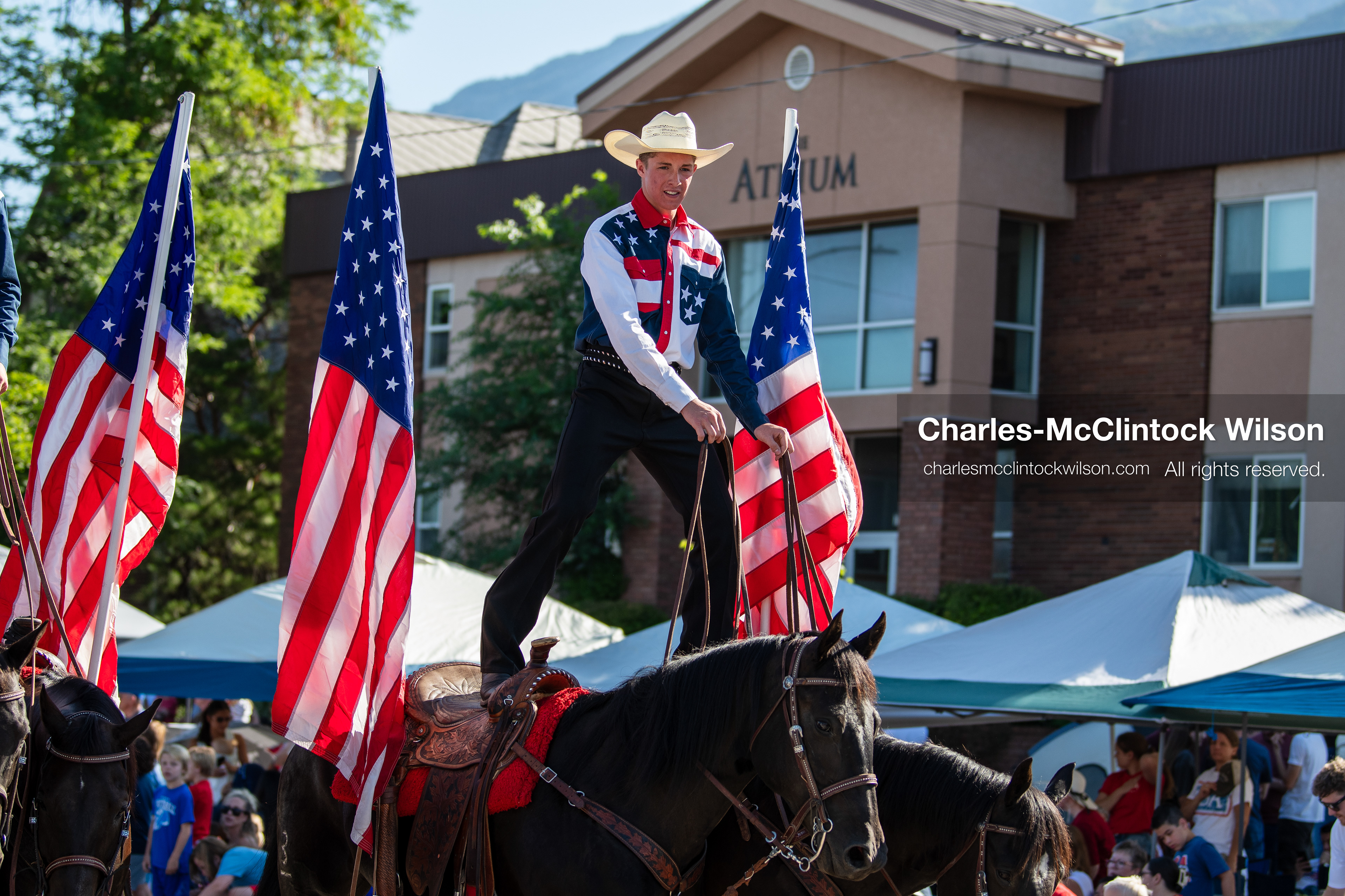  July 4, 2026, Provo, Utah, USA: Equestrian performers balance upright on horseback while carrying American flags down the street during America's Freedom Festival Grand Parade in Provo, Utah, Saturday, July 4, 2026. The annual Independence Day event features expanded programming to honor the 250th anniversary of United States independence. (Credit Image: © Charles-McClintock Wilson/ZUMA Press Wire)